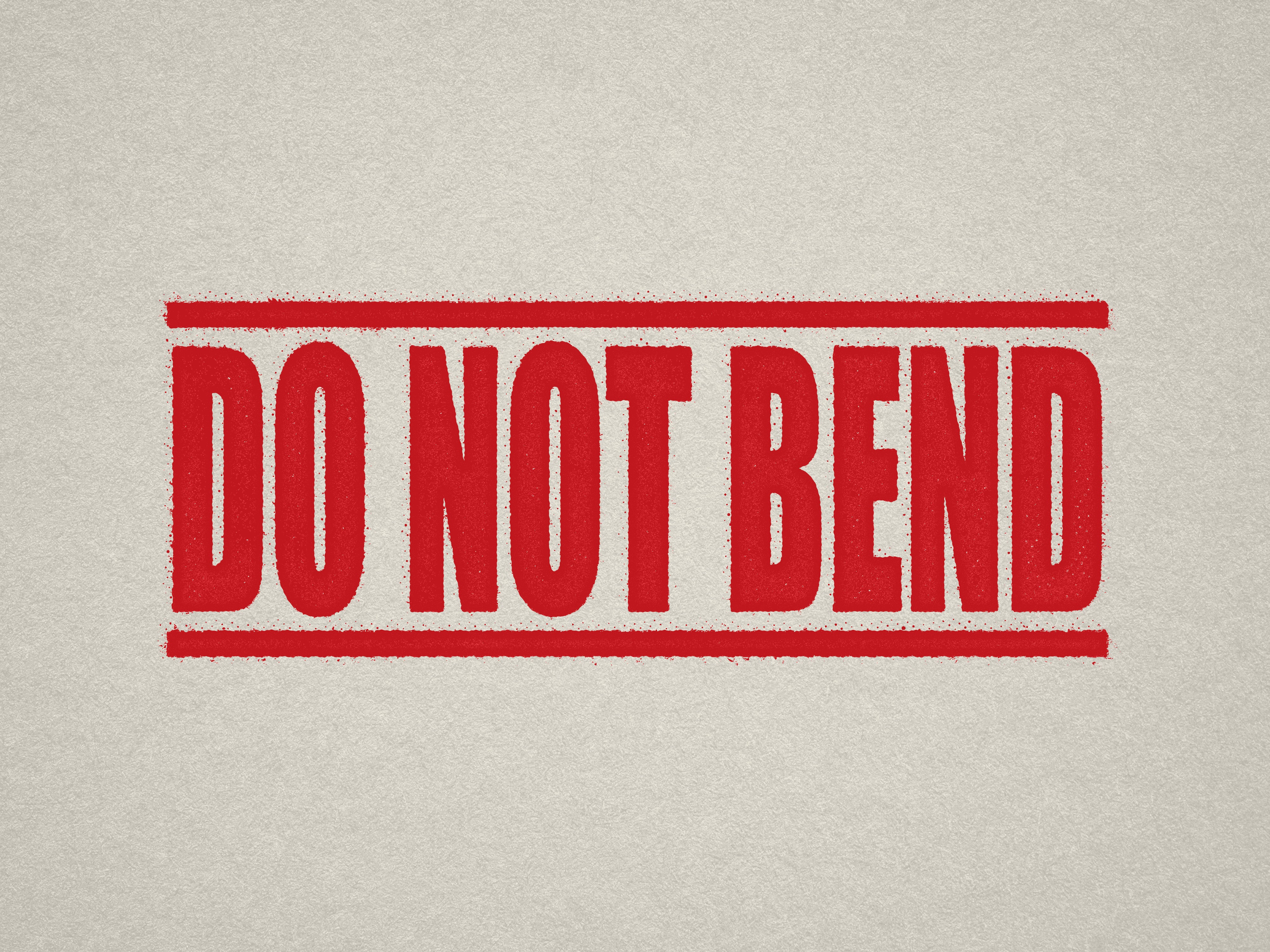 mock up design of DO NOT BEND rubber stamp red ink in paper background stampers hand stamp office business inventory documents