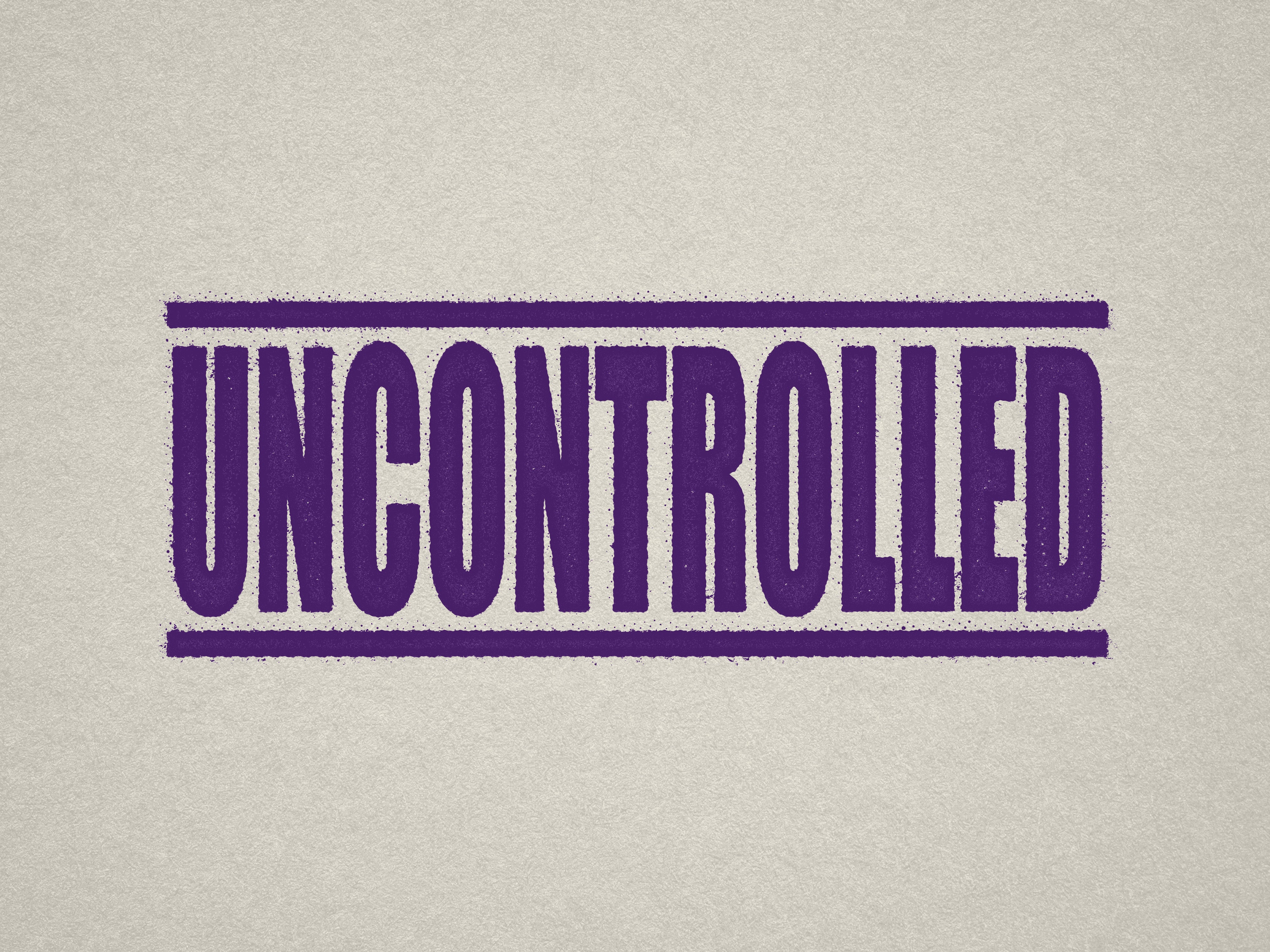 Mock up design or lifestyle image of 'UNCONTROLLED' rubber stamp violet ink in paper background stampers hand stamp office business inventory documents self inking prefill refillable stamps stamping