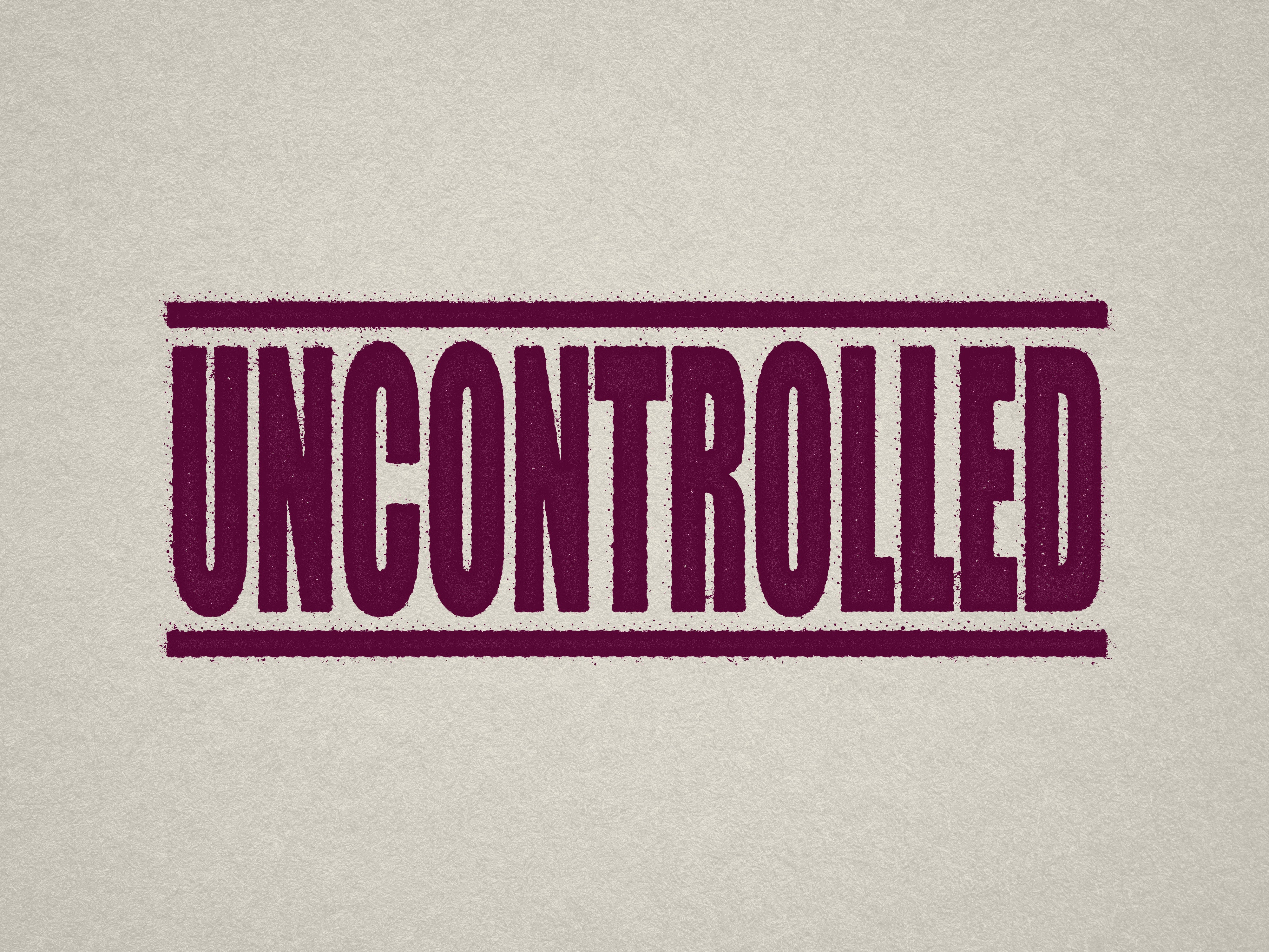 Mock up design or lifestyle image of 'UNCONTROLLED' rubber stamp maroon ink in paper background stampers hand stamp office business inventory documents self inking prefill refillable stamps stamping