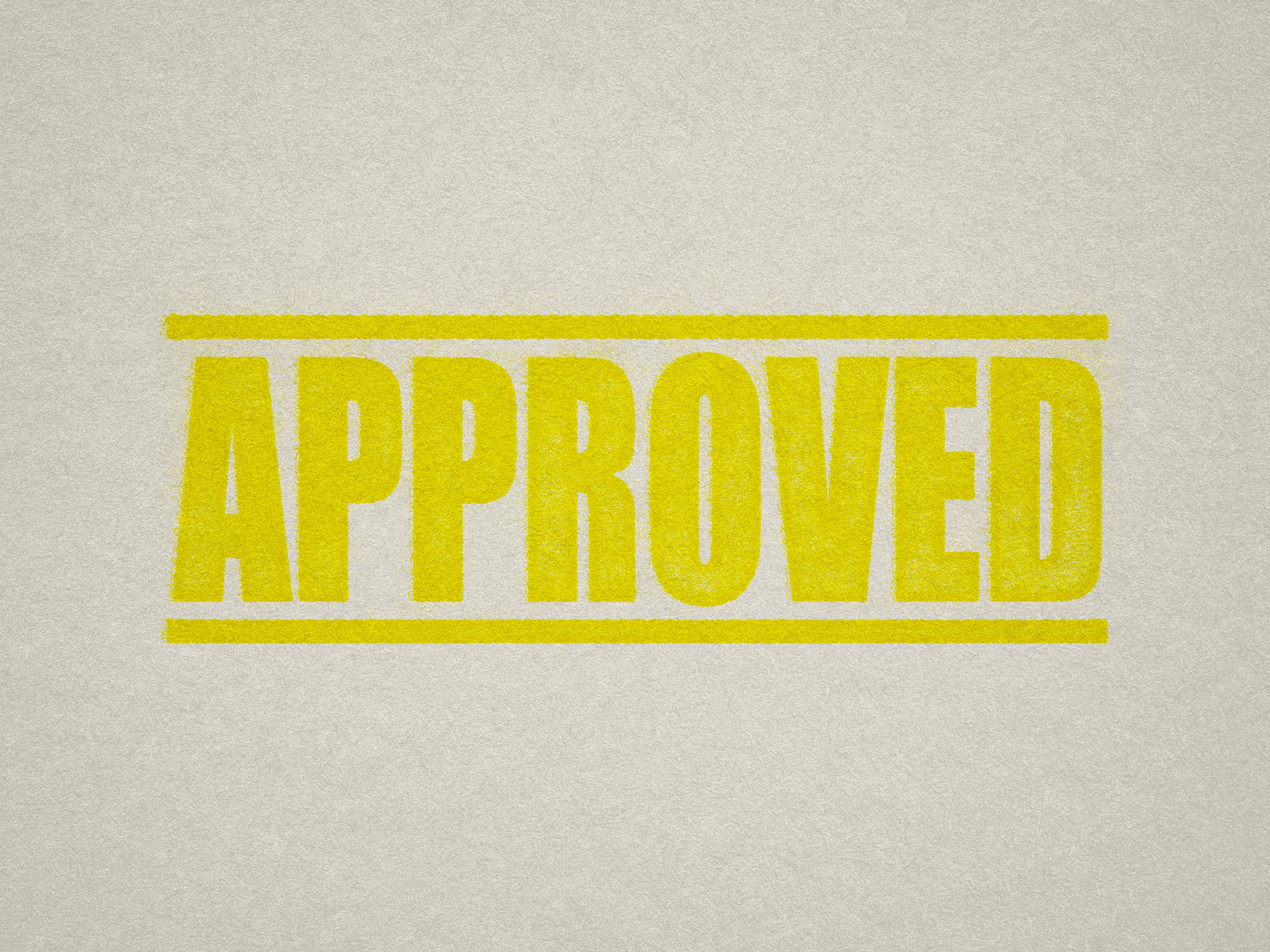 Mock up design or lifestyle image of 'APPROVED' rubber stamp yellow ink in paper background stampers hand stamp office business inventory documents self inking prefill refillable stamps stamping
