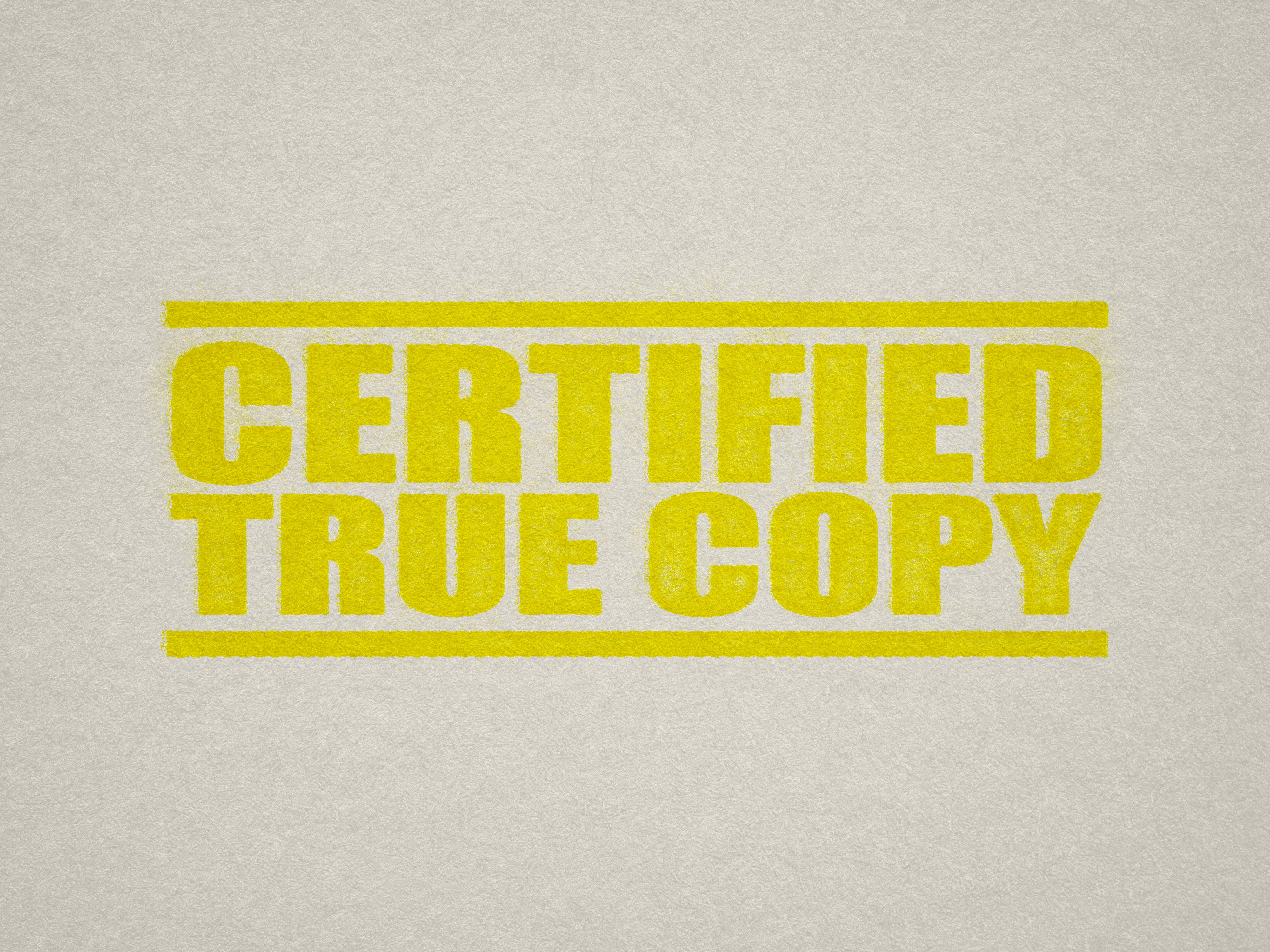 mock up design of 'Certified True Copy' rubber stamp yellow ink in paper background stampers hand stamp office business inventory documents self inking prefill refillable stamps stamping