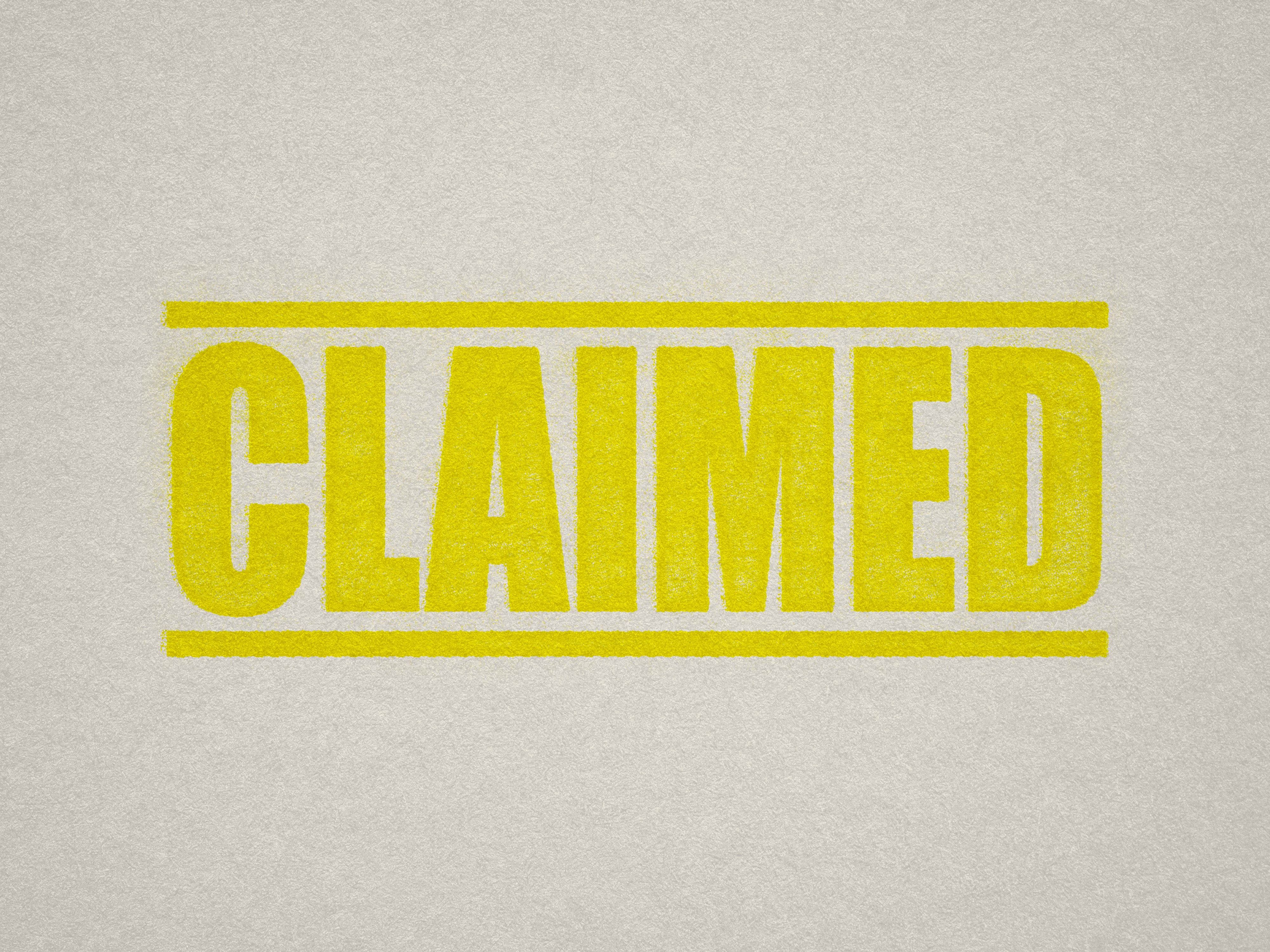 mock up design of 'Claimed' rubber stamp yellow ink in paper background stampers hand stamp office business inventory documents self inking prefill refillable stamps stamping