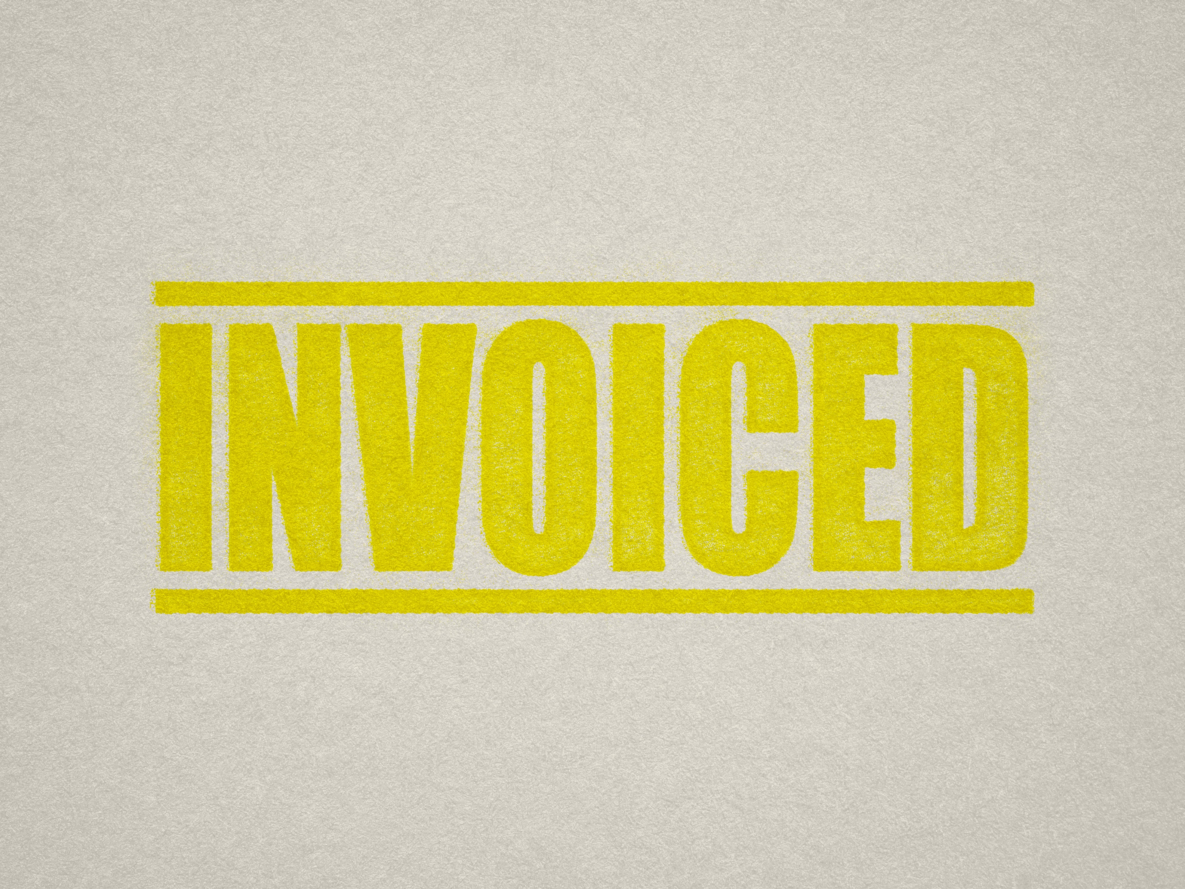 mock up design of INVOICED rubber stamp yellow ink in paper background stampers hand stamp office business inventory documents