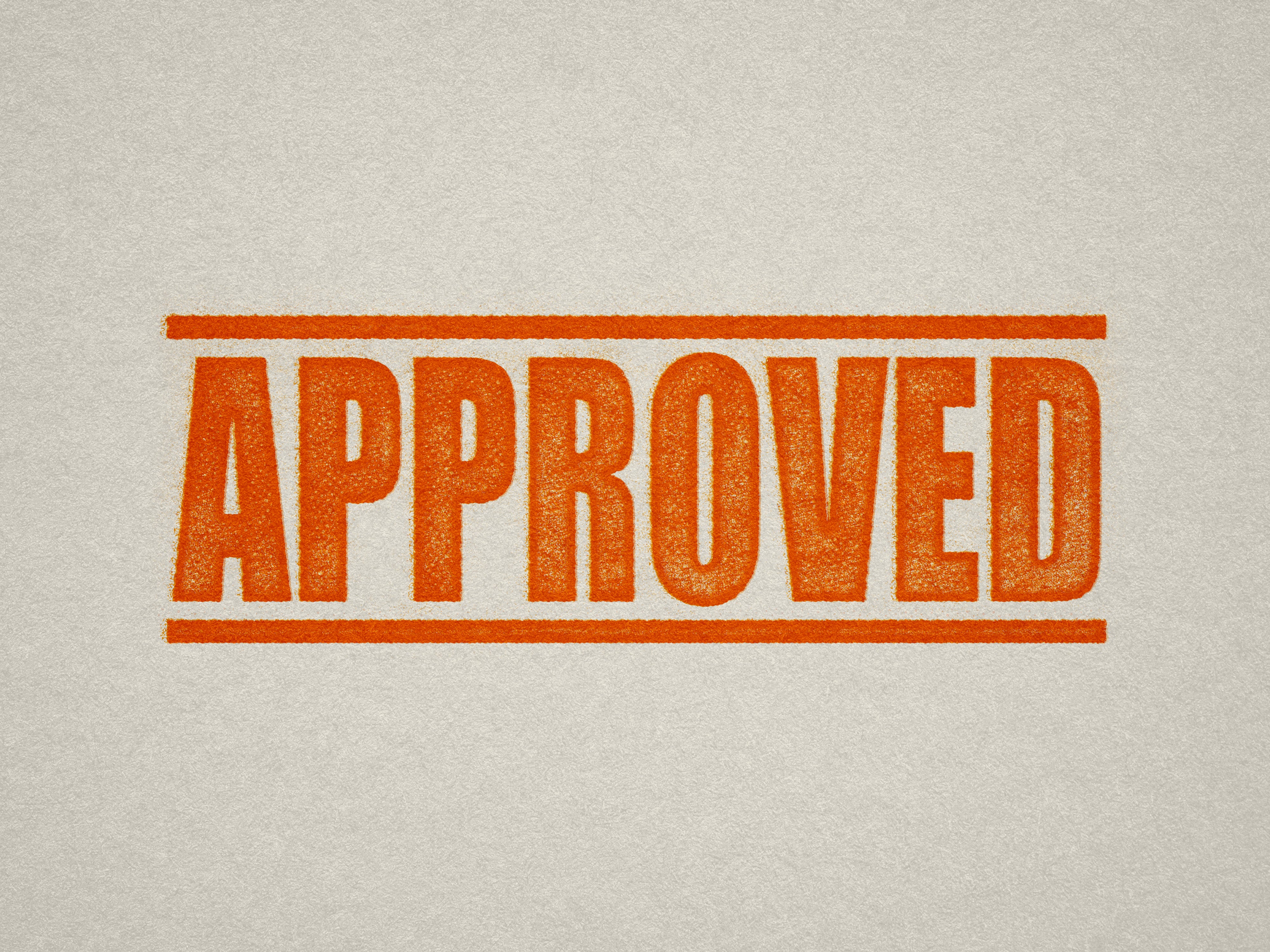Mock up design or lifestyle image of 'APPROVED' rubber stamp orange ink in paper background stampers hand stamp office business inventory documents self inking prefill refillable stamps stamping