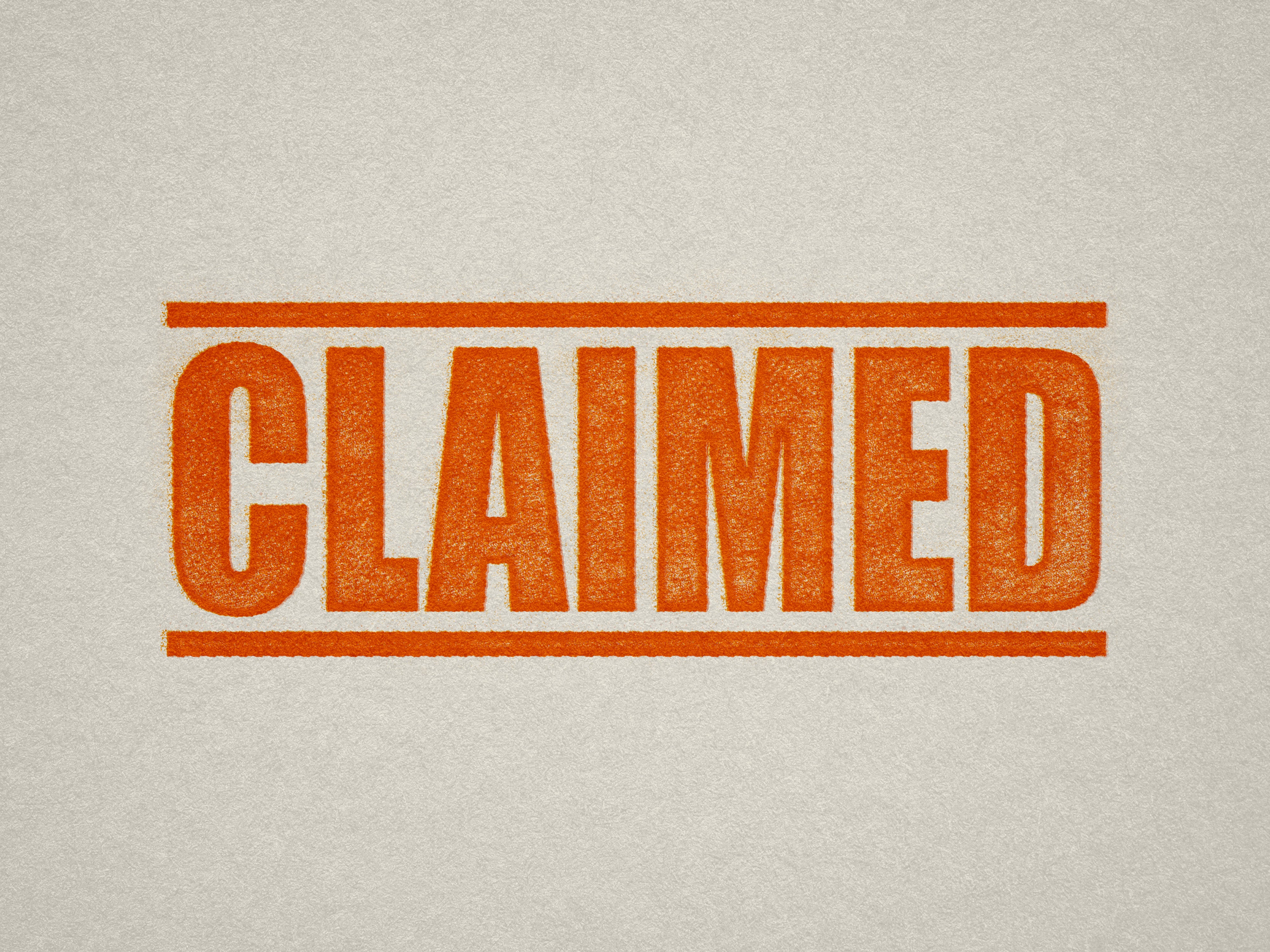 mock up design of 'Claimed' rubber stamp orange ink in paper background stampers hand stamp office business inventory documents self inking prefill refillable stamps stamping