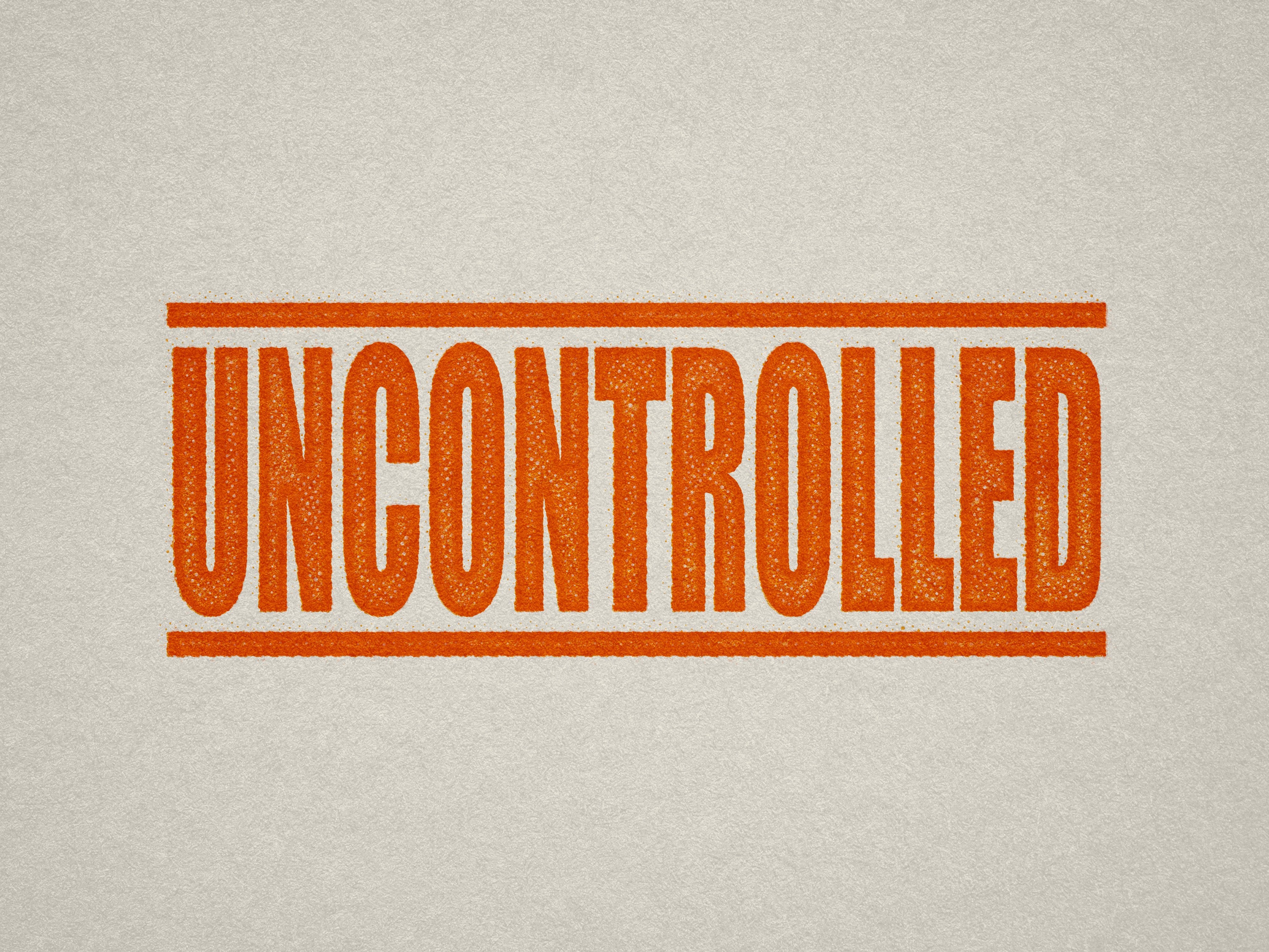 Mock up design or lifestyle image of 'UNCONTROLLED' rubber stamp orange ink in paper background stampers hand stamp office business inventory documents self inking prefill refillable stamps stamping