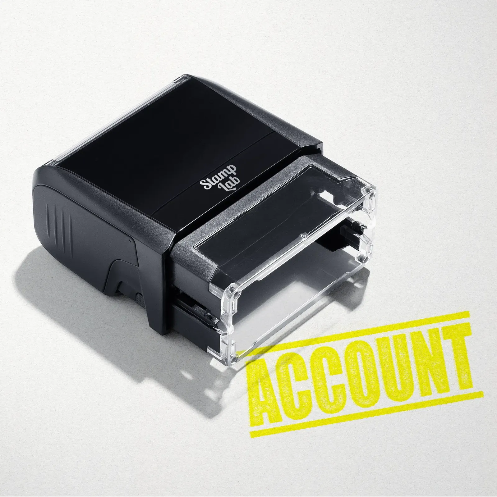 mock up design or lifestyle image of 'Account' rubber stamp yellow ink in paper background stampers hand stamp office business inventory documents self inking prefill refillable stamps stamping