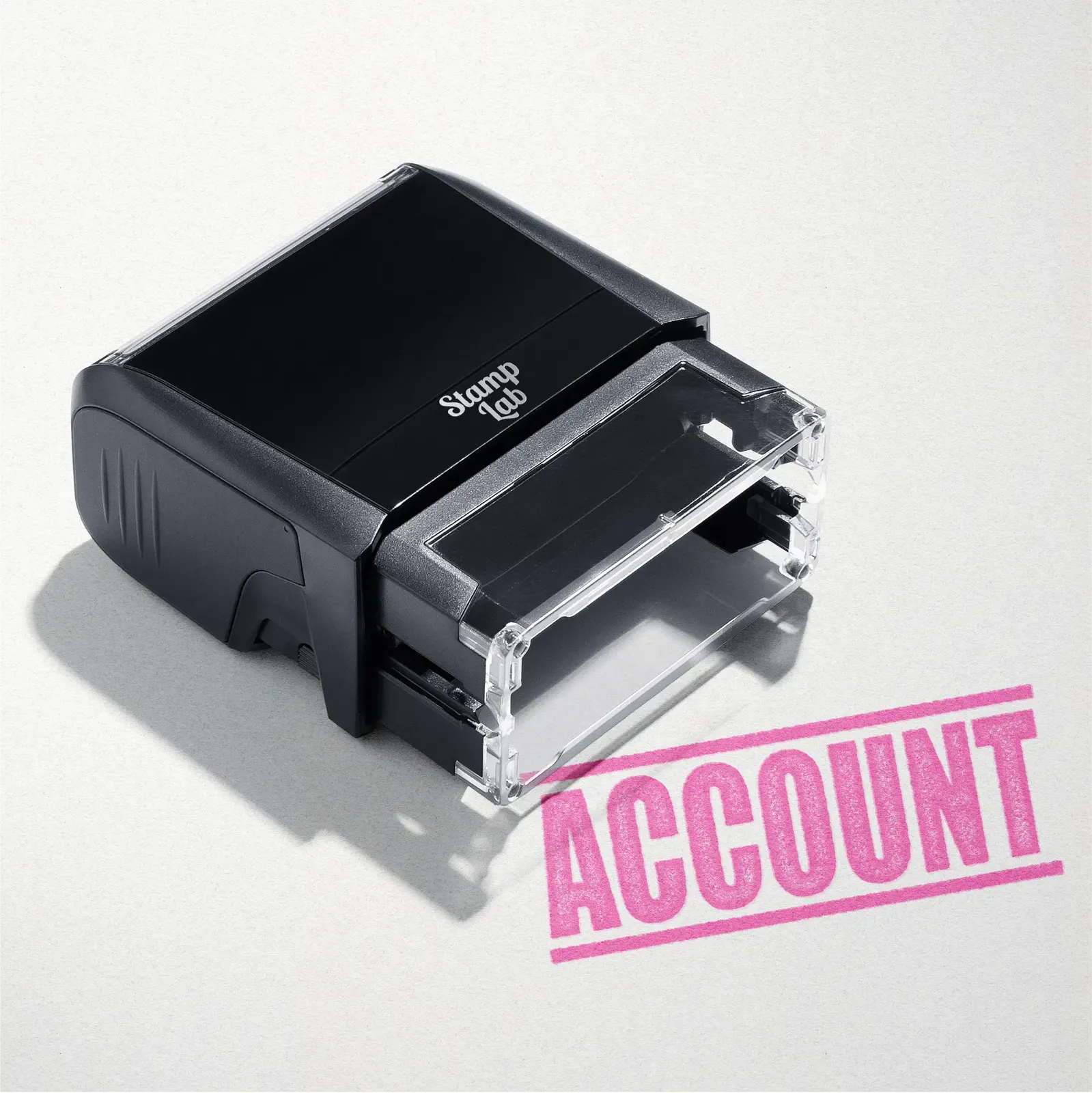 mock up design or lifestyle image of 'Account' rubber stamp pink ink in paper background stampers hand stamp office business inventory documents self inking prefill refillable stamps stamping