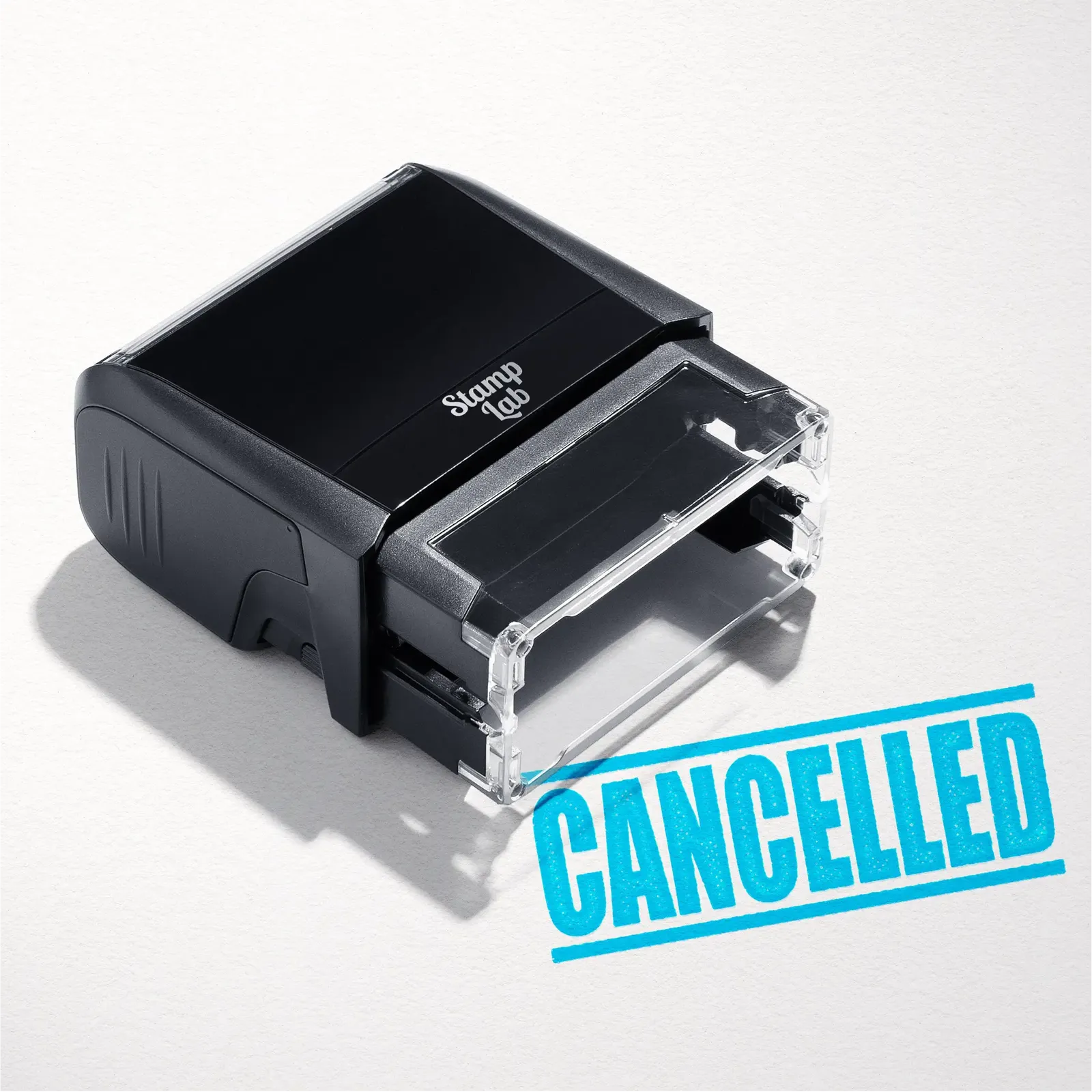 mock up design or lifestyle image of 'Cancelled' rubber stamp turquoise ink in paper background stampers hand stamp office business inventory documents self inking prefill refillable stamps stamping