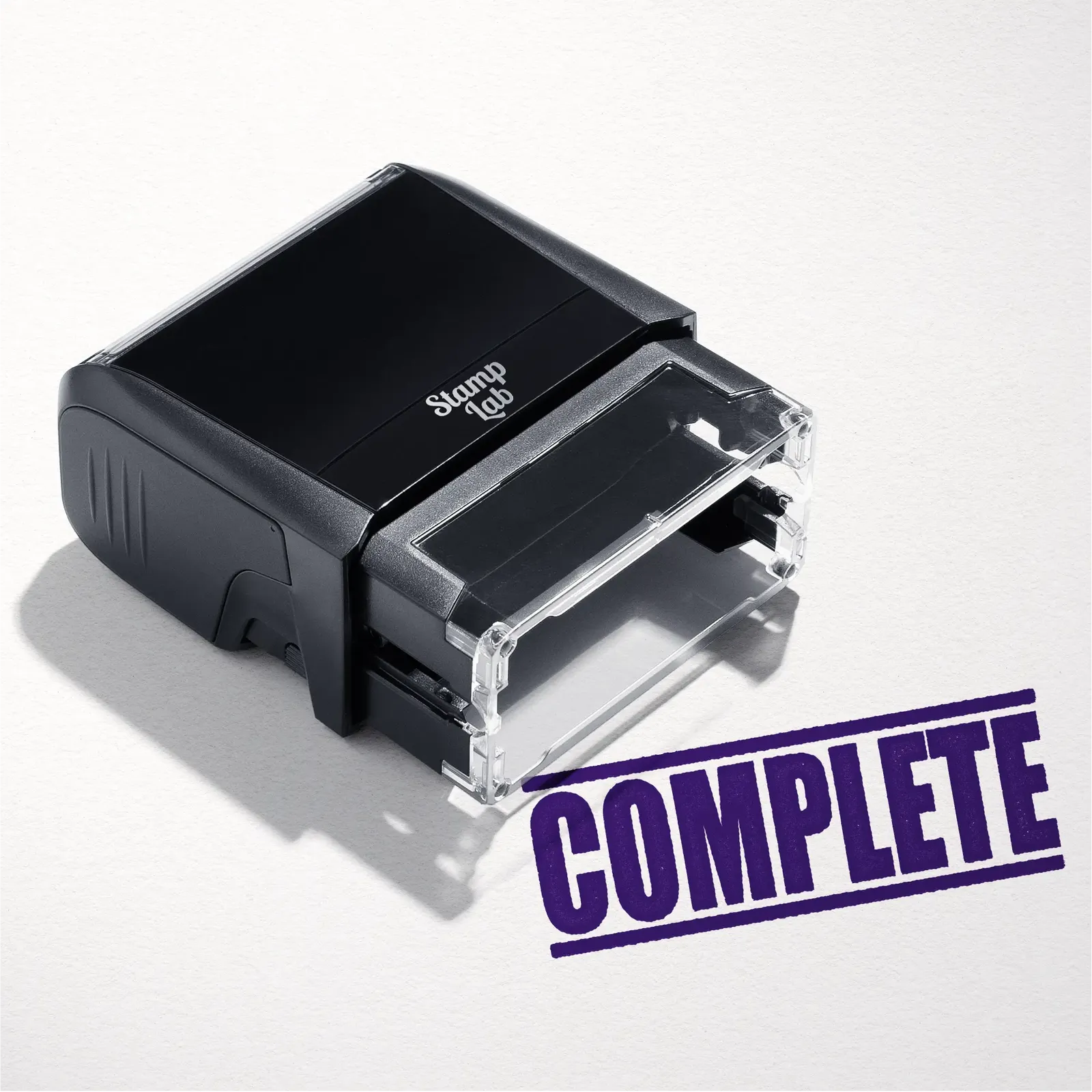 mock up design or lifestyle image of 'Complete' rubber stamp violet ink in paper background stampers hand stamp office business inventory documents purple