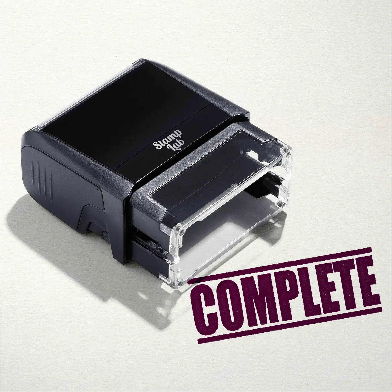 mock up design or lifestyle image of 'Complete' rubber stamp maroon ink in paper background stampers hand stamp office business inventory documents