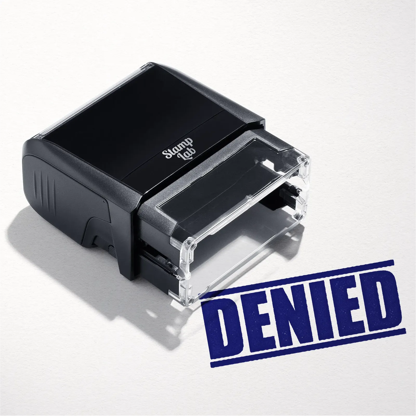 mock up design or lifestyle image of 'Denied' rubber stamp blue ink in paper background stampers hand stamp office business inventory documents self inking prefill refillable stamps stamping