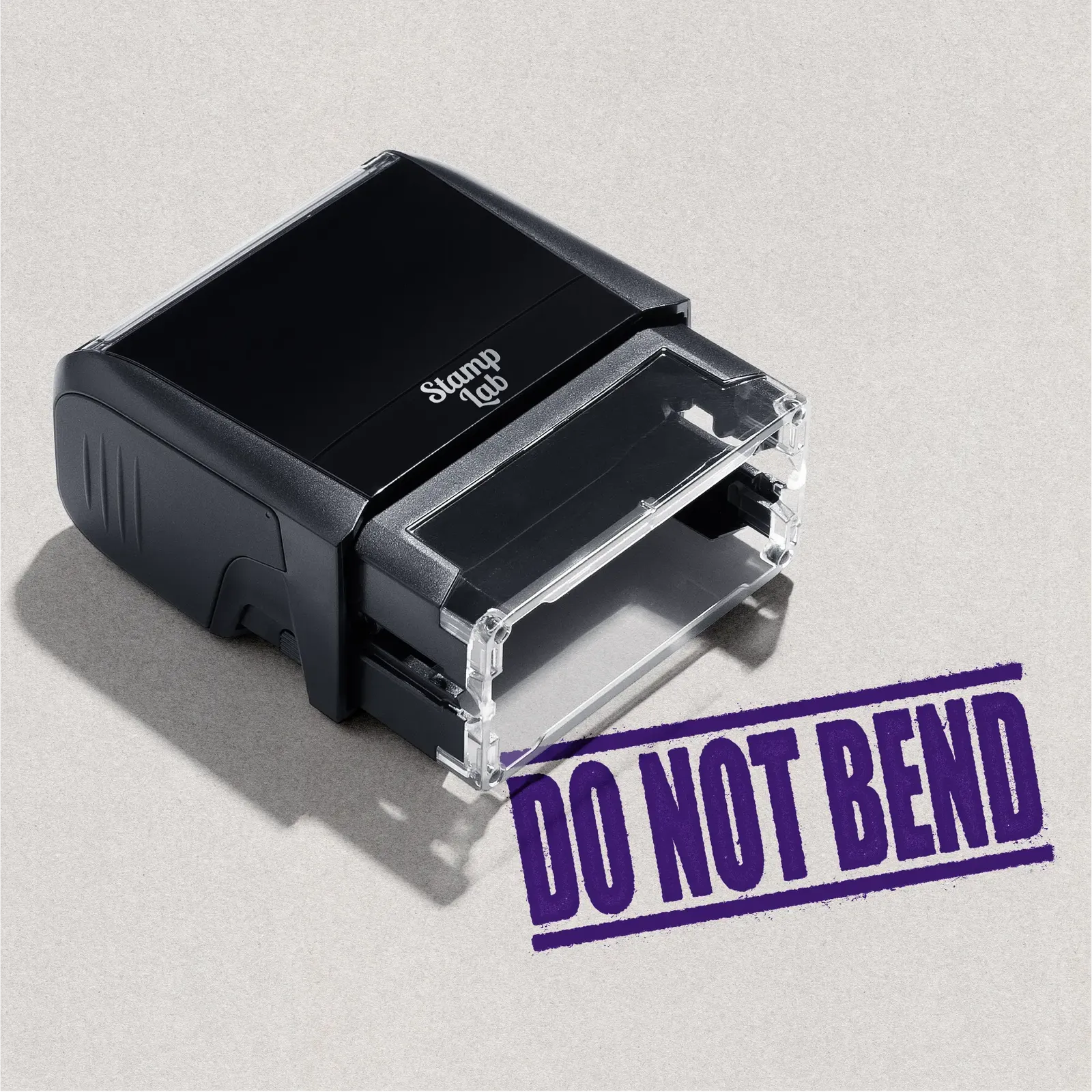 mock up design or lifestyle image of DO NOT BEND rubber stamp violet ink in paper background stampers hand stamp office business inventory documents