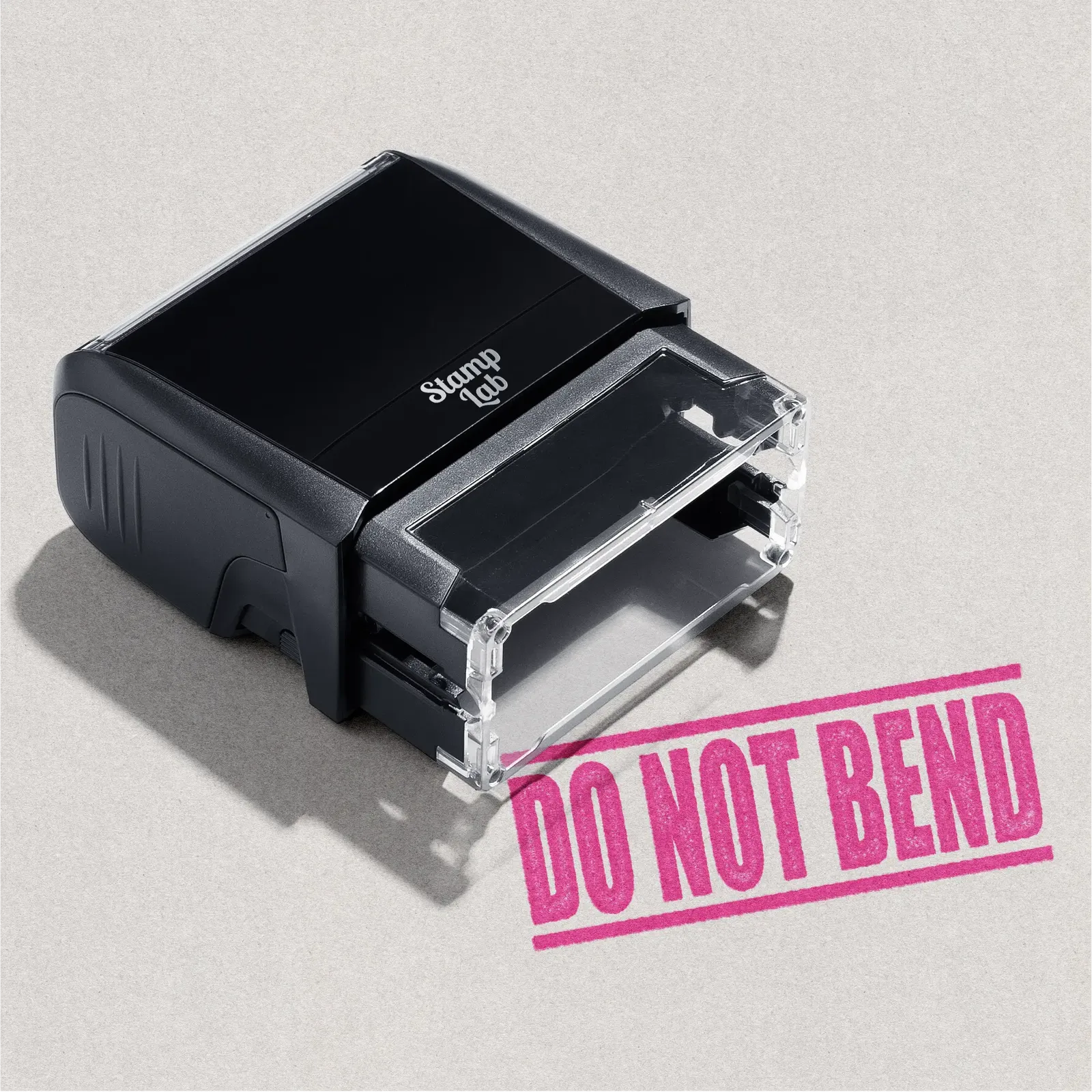 mock up design or lifestyle image of DO NOT BEND rubber stamp pink ink in paper background stampers hand stamp office business inventory documents