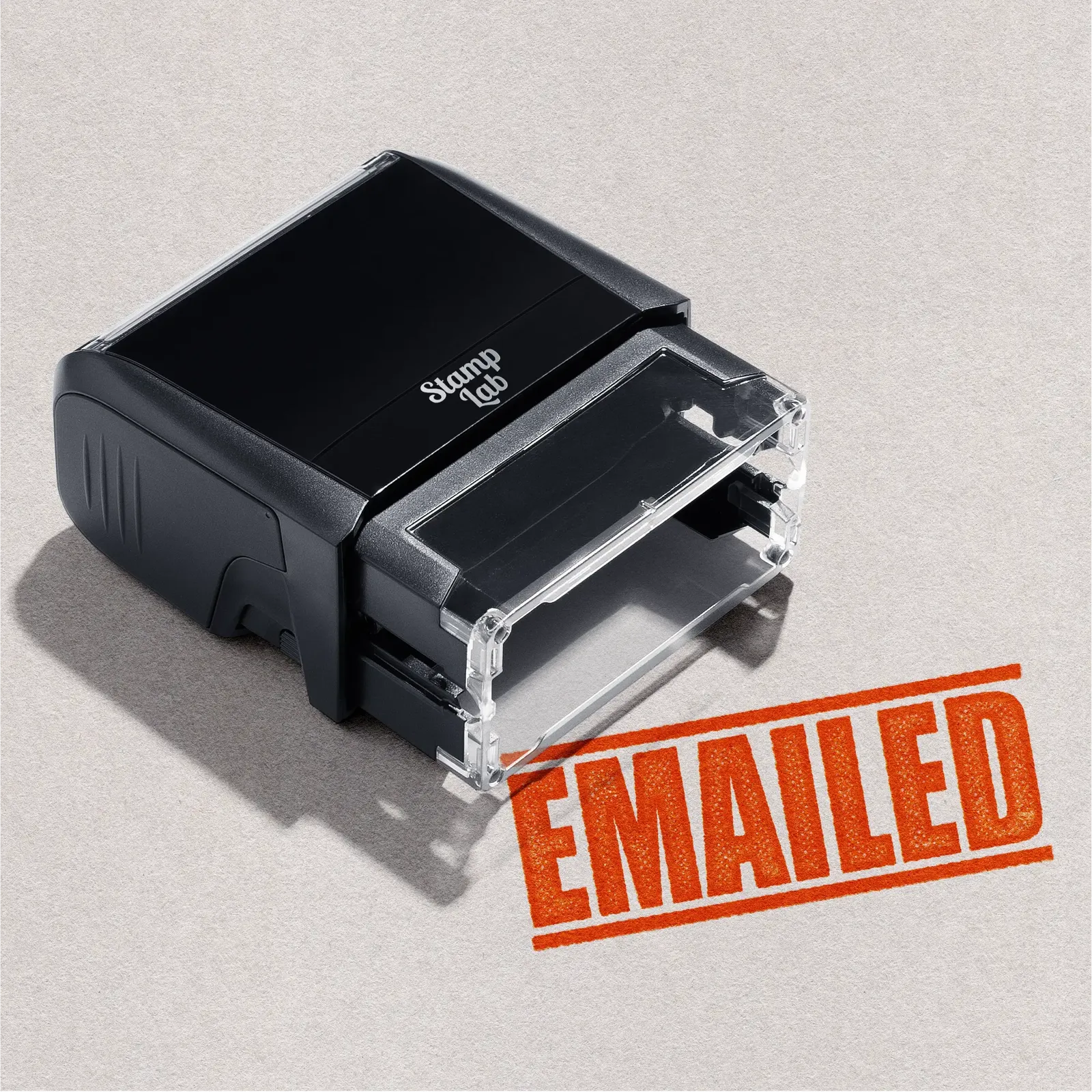 Mock up design or lifestyle image of 'EMAILED' rubber stamp orange ink in paper background stampers hand stamp office business inventory documents
