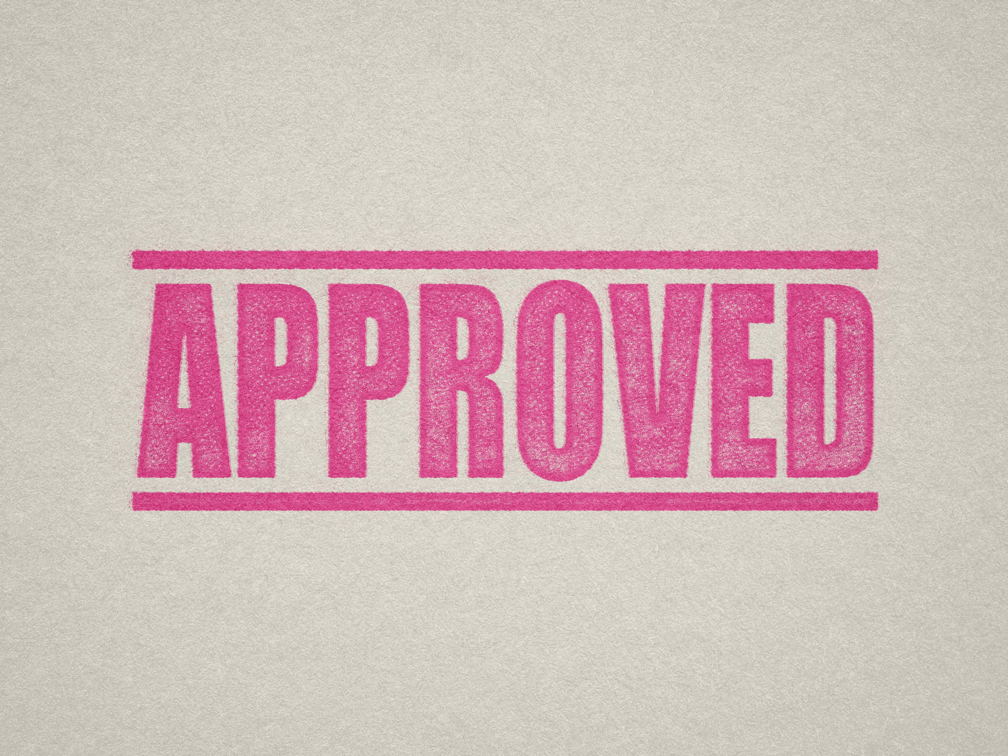 Mock up design or lifestyle image of 'APPROVED' rubber stamp pink ink in paper background stampers hand stamp office business inventory documents self inking prefill refillable stamps stamping