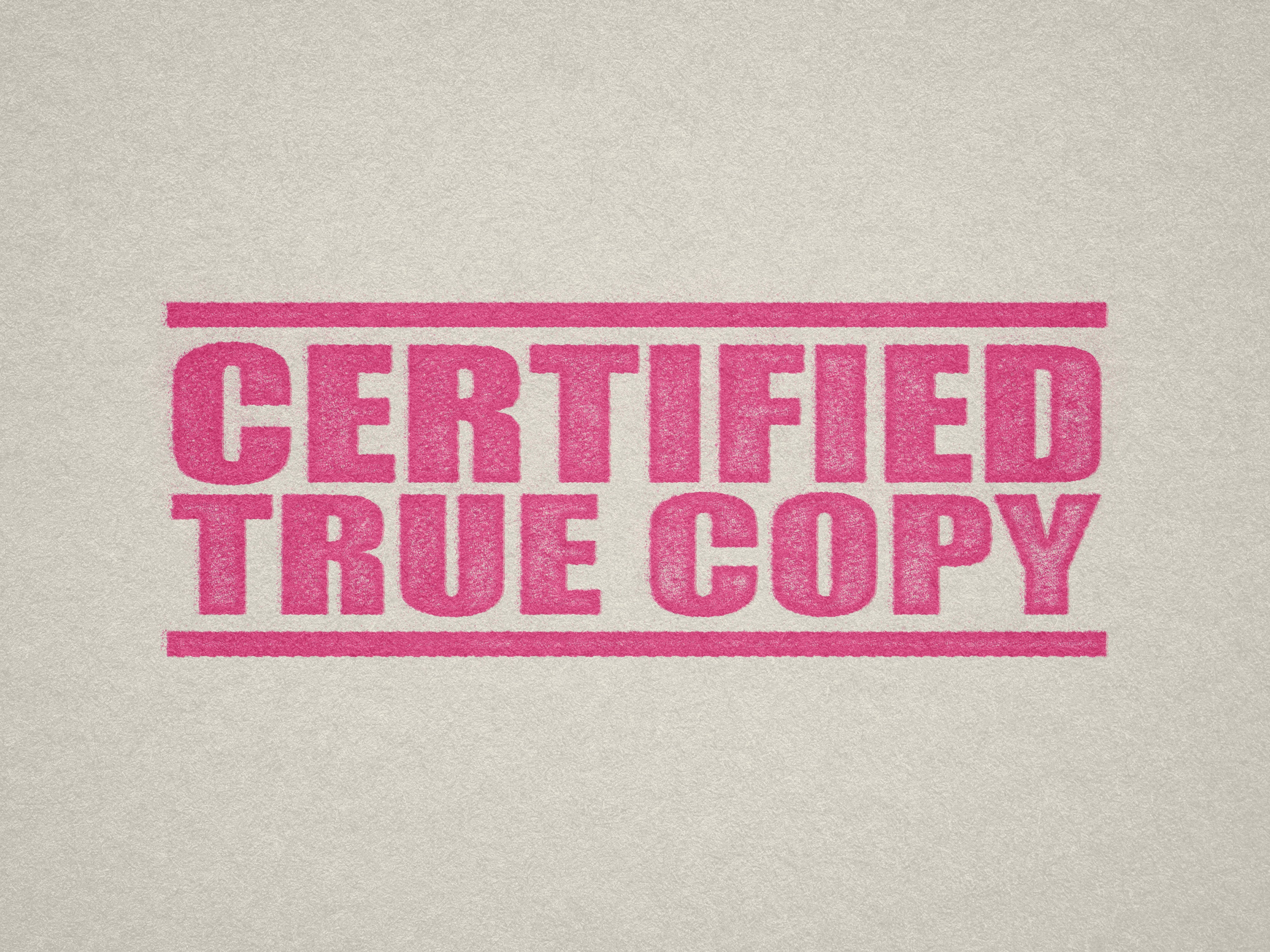 mock up design of 'Certified True Copy' rubber stamp pink ink in paper background stampers hand stamp office business inventory documents self inking prefill refillable stamps stamping