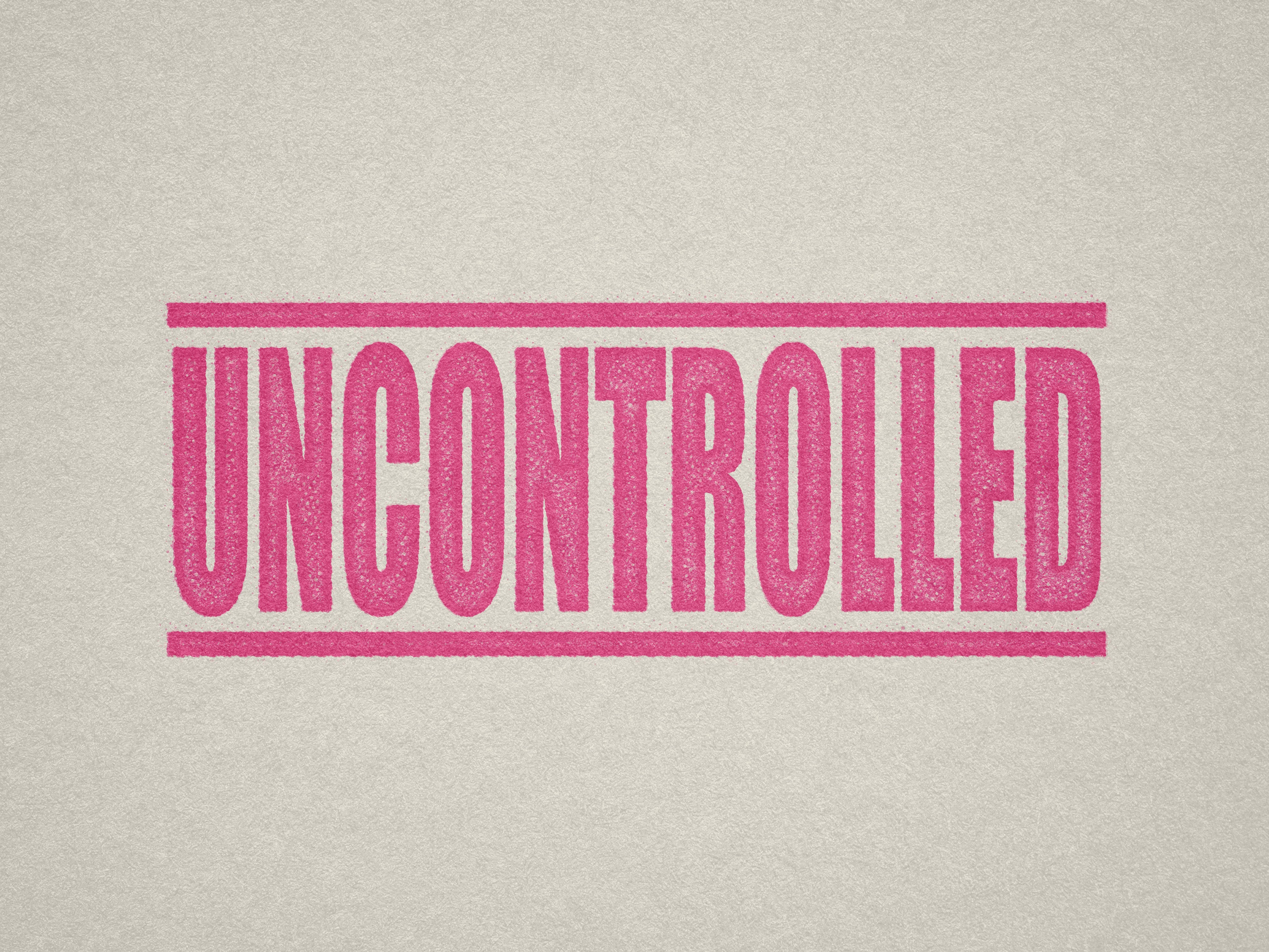 Mock up design or lifestyle image of 'UNCONTROLLED' rubber stamp pink ink in paper background stampers hand stamp office business inventory documents self inking prefill refillable stamps stamping