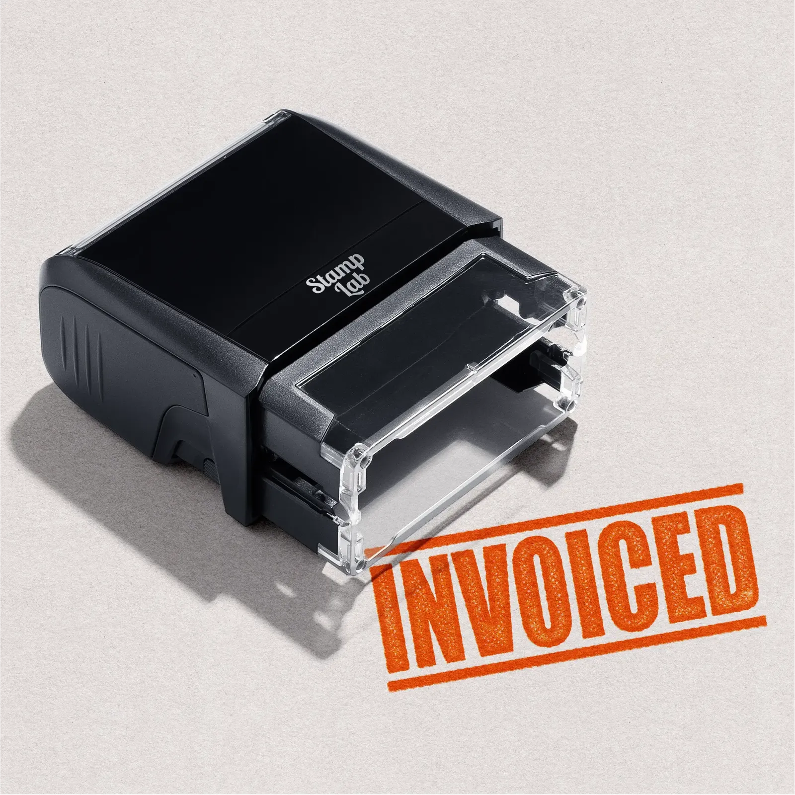 mock up design or lifestyle image of INVOICED rubber stamp orange ink in paper background stampers hand stamp office business inventory documents