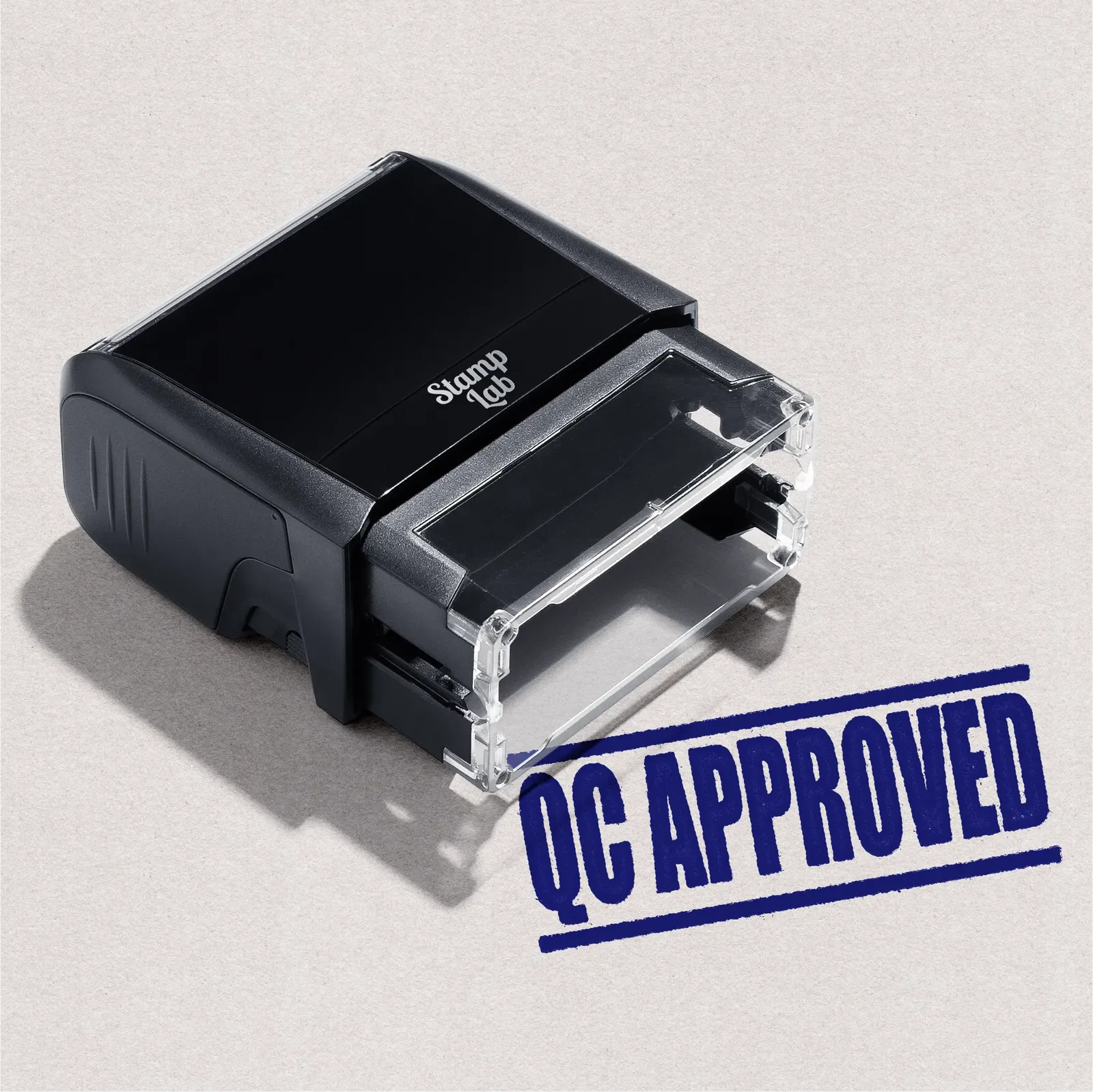 self-inking stamp with 'QC Approved' blue ink
