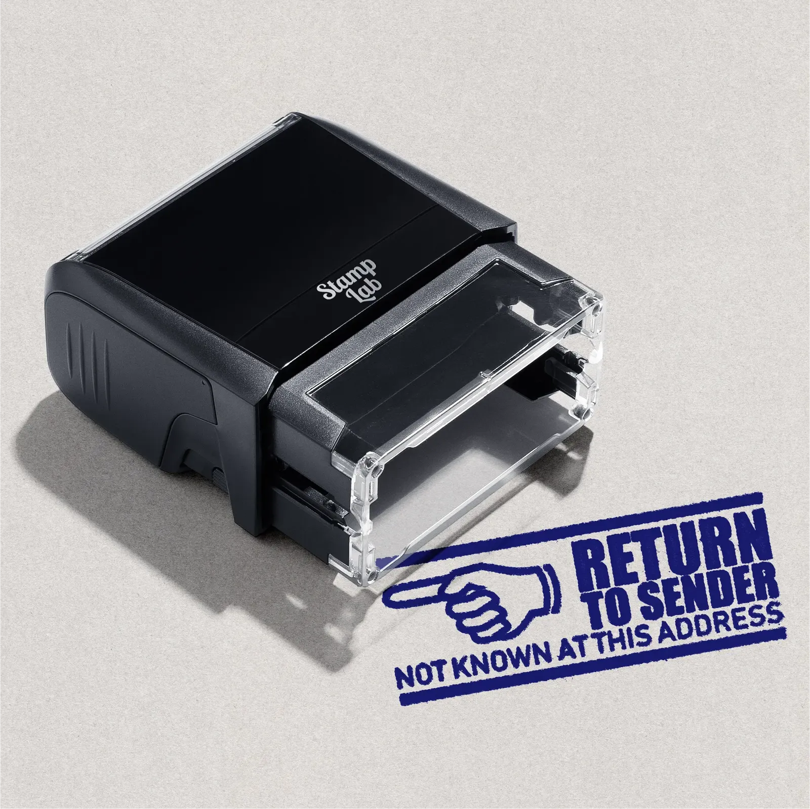 Black self-inking stamp with 'Return to Sender' text in Blue ink on a gray background