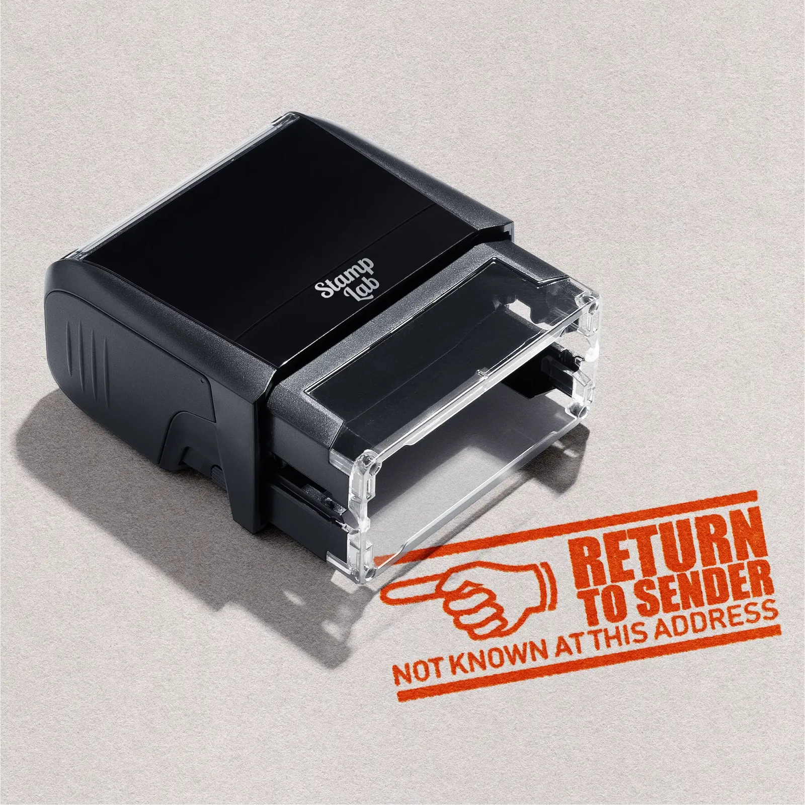 Black stamp with pre-designed 'Return to Sender' text orange ink
