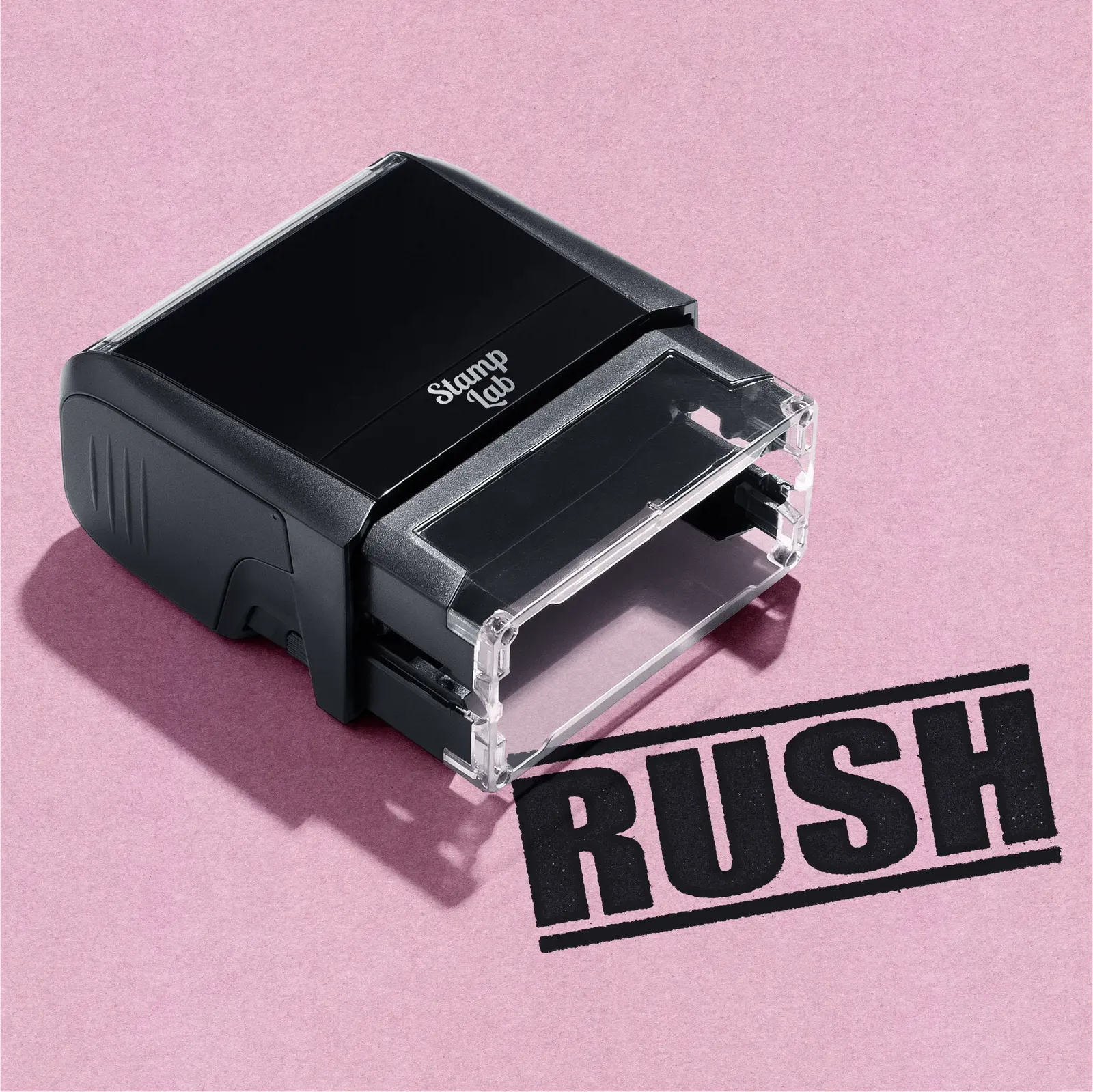 Black pre-inked stamp with 'RUSH' text on a pink background