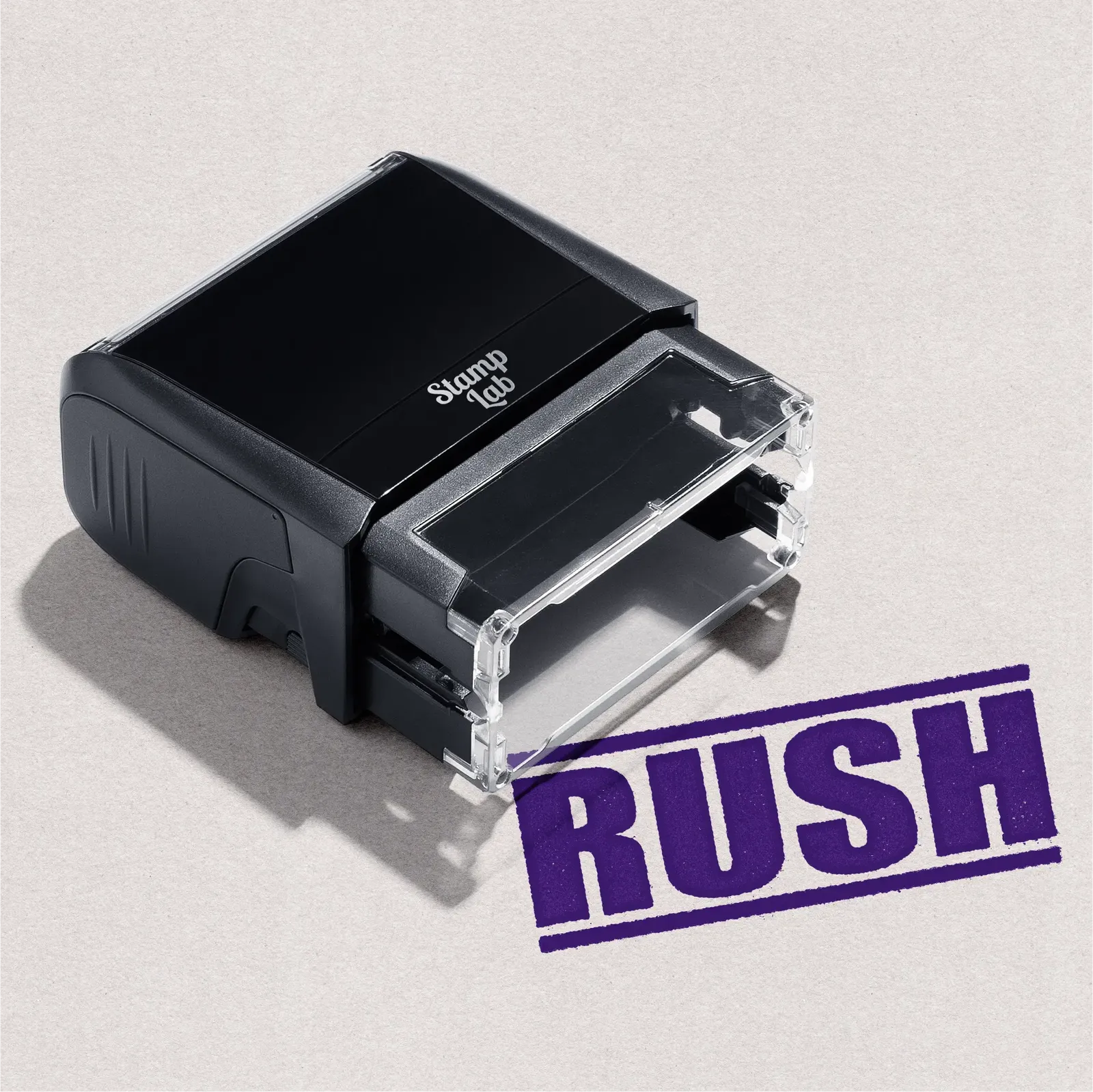 Self-inking office stamp Violet ink featuring the word "Rush" in bold text