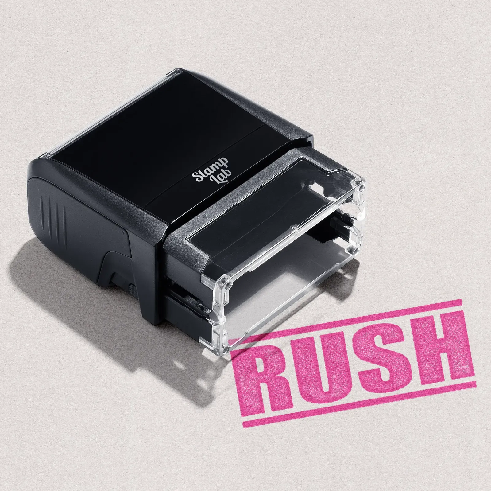 Black self-inking stamp with pink 'RUSH' text pre-designed