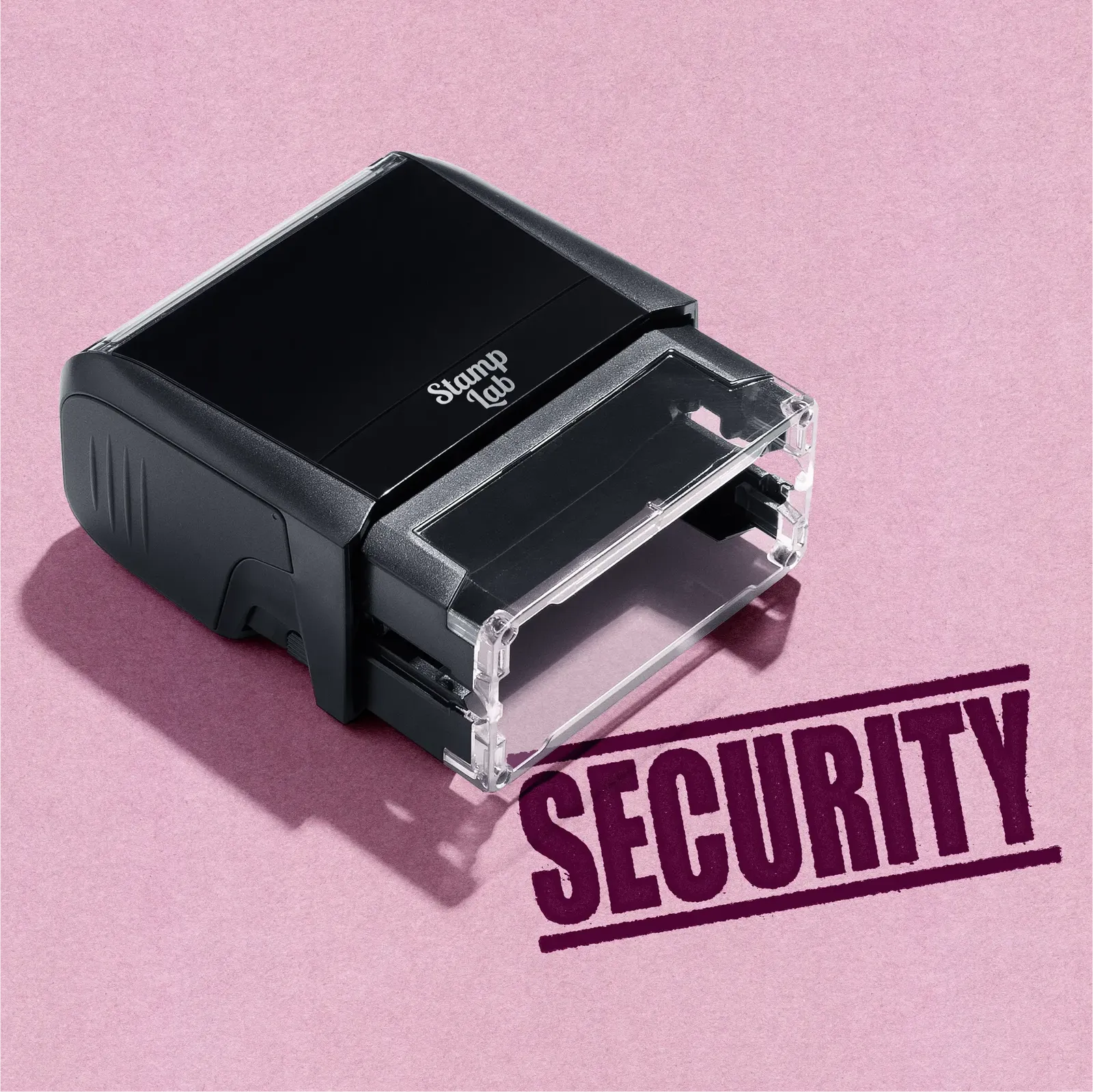 Black stamp machine with 'Security' stamp on pink background