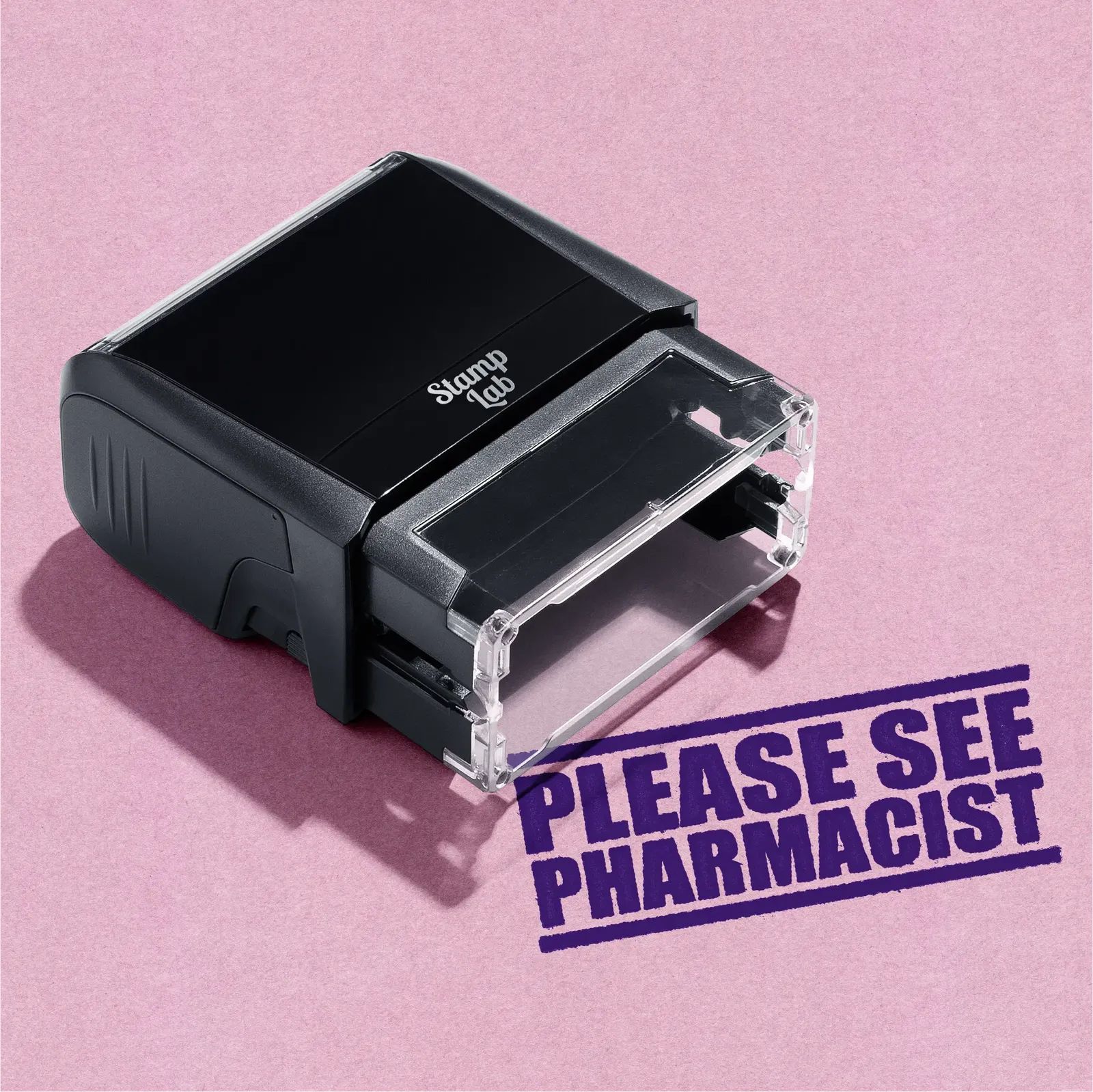 Black self-inking stamp with 'Please See Pharmacist' Violet text on a pink background