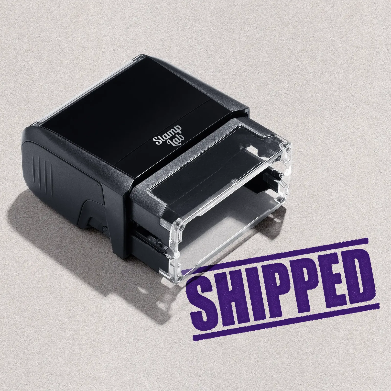 Purple "SHIPPED" self-inking stamper