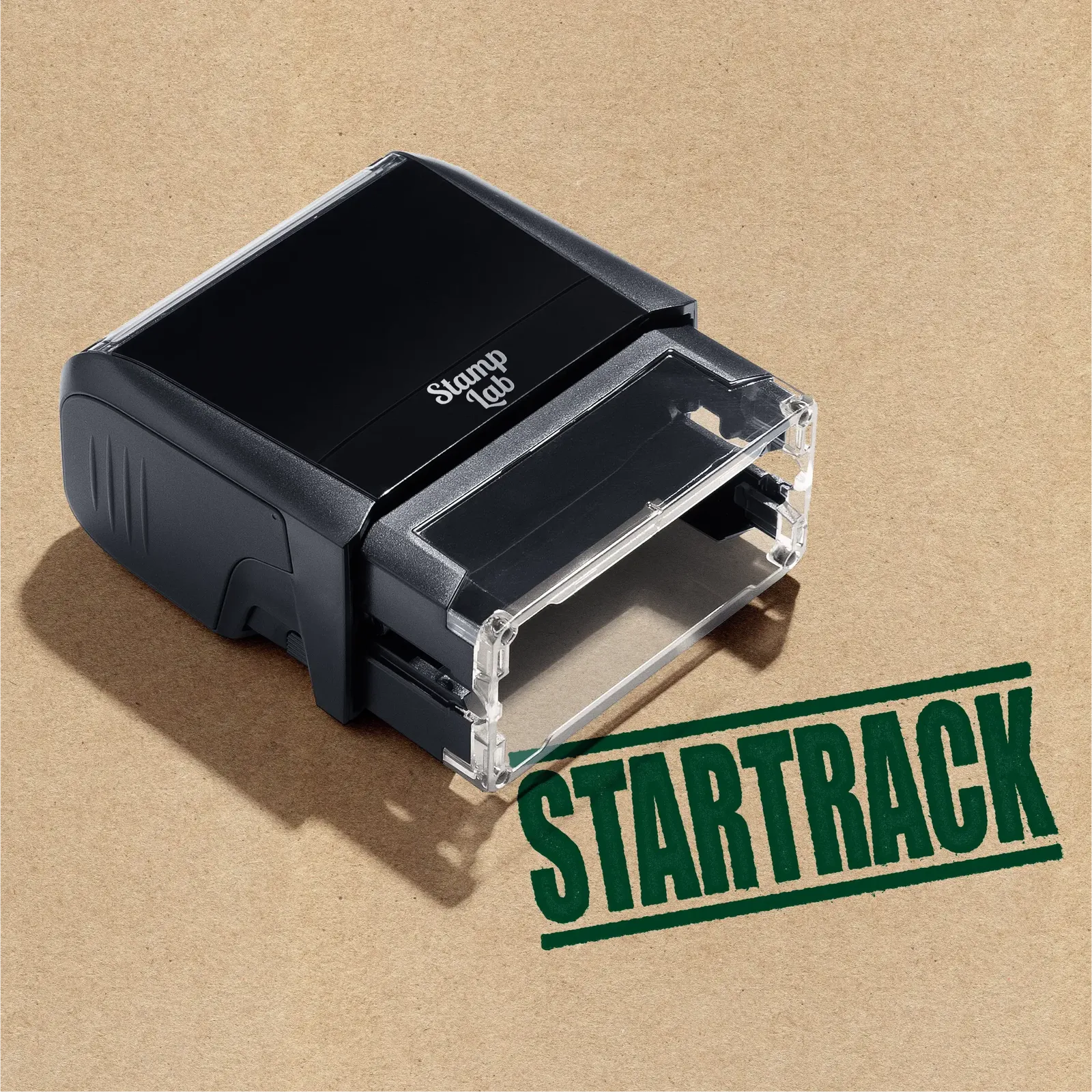 Black self-inking stamp machine featuring the word 'STARTRACK' Impression in green ink
