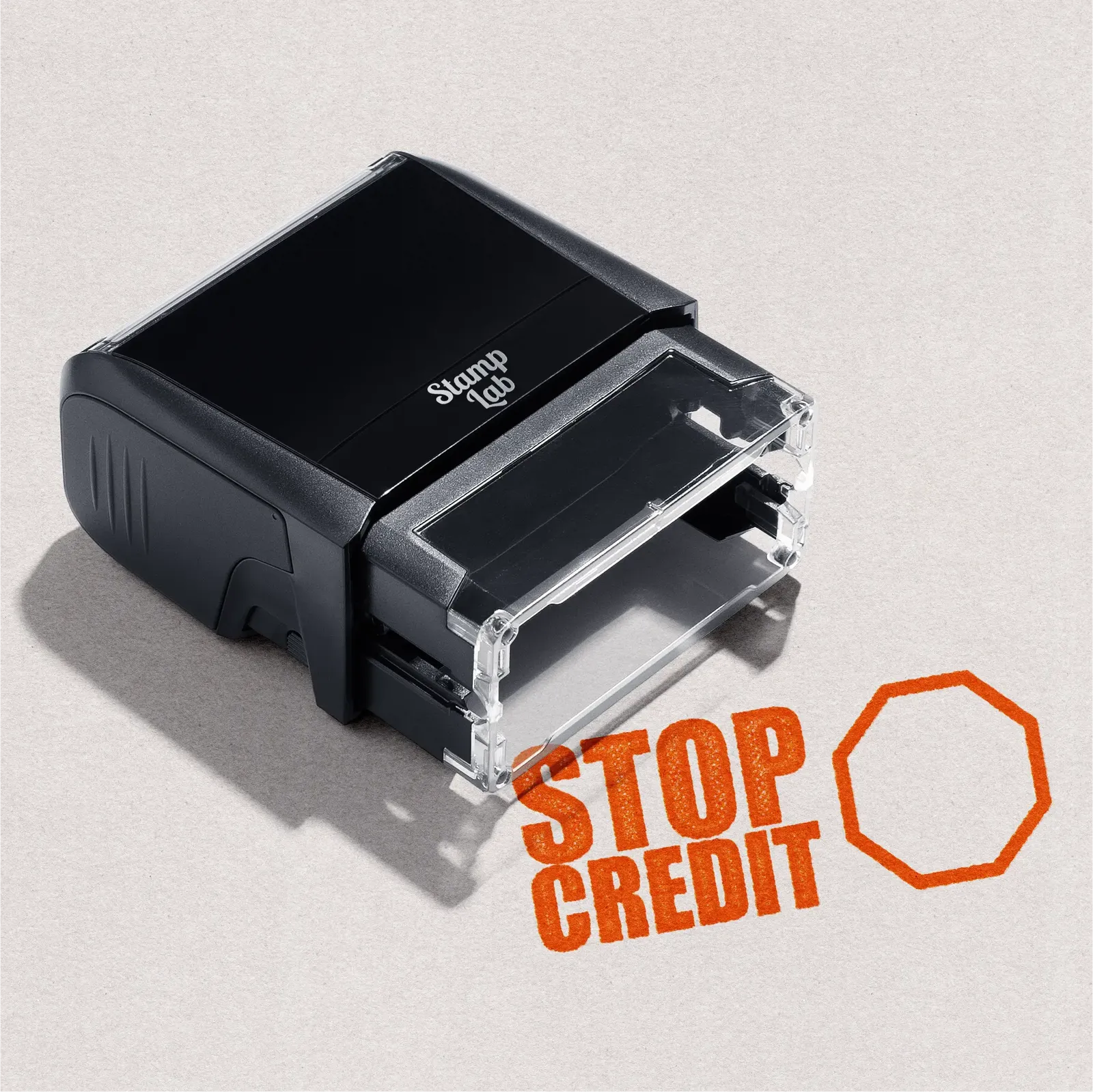 pre-inked stamp with 'Stop Credit' text in Orange Ink