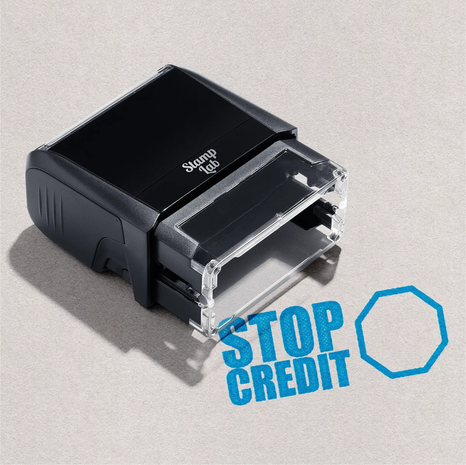 Black self-inking stamp with 'Stop Credit' text in Turquoise Ink