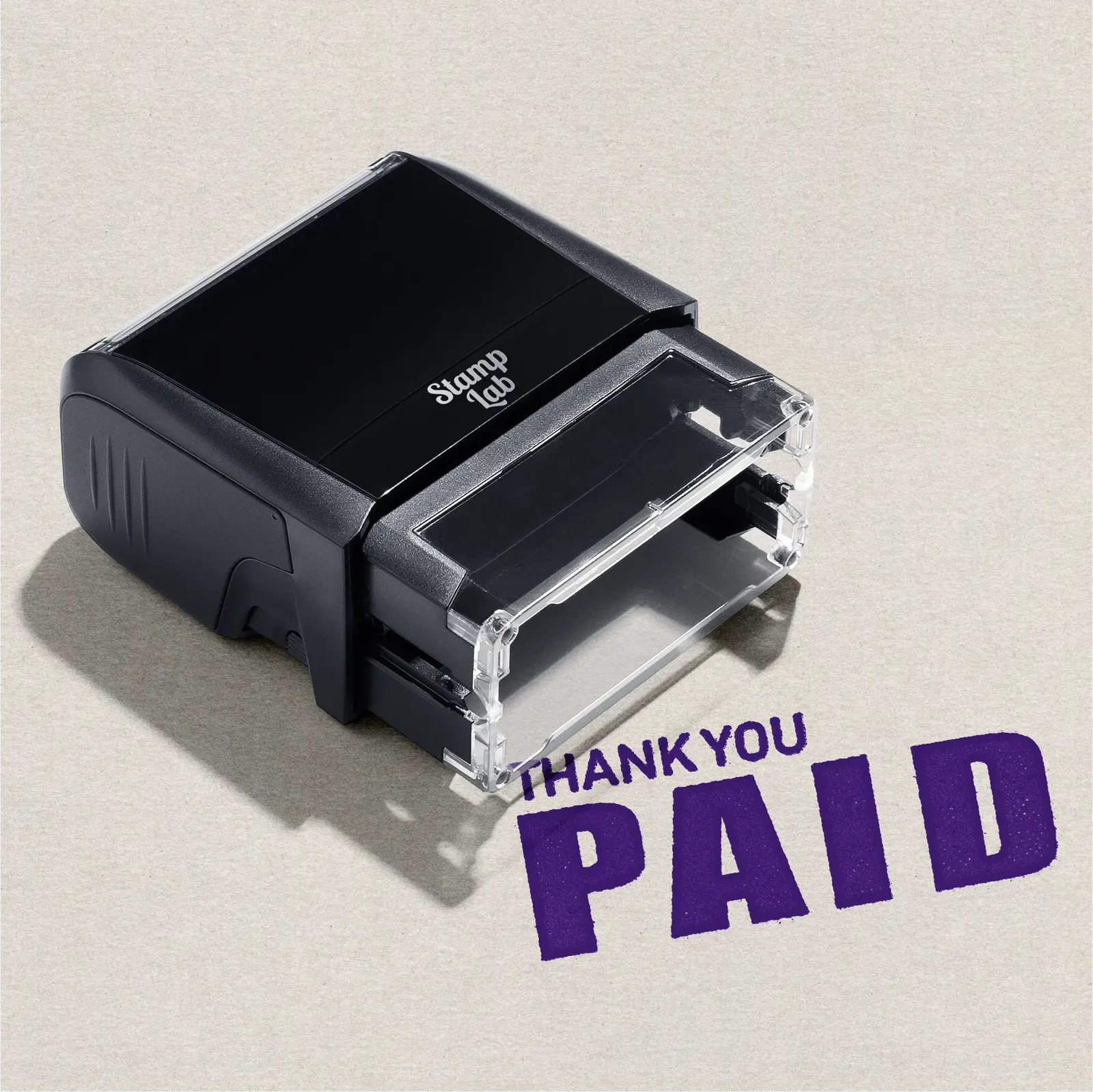 Black self-inking stamp with 'Thank You Paid' text in Violet Ink