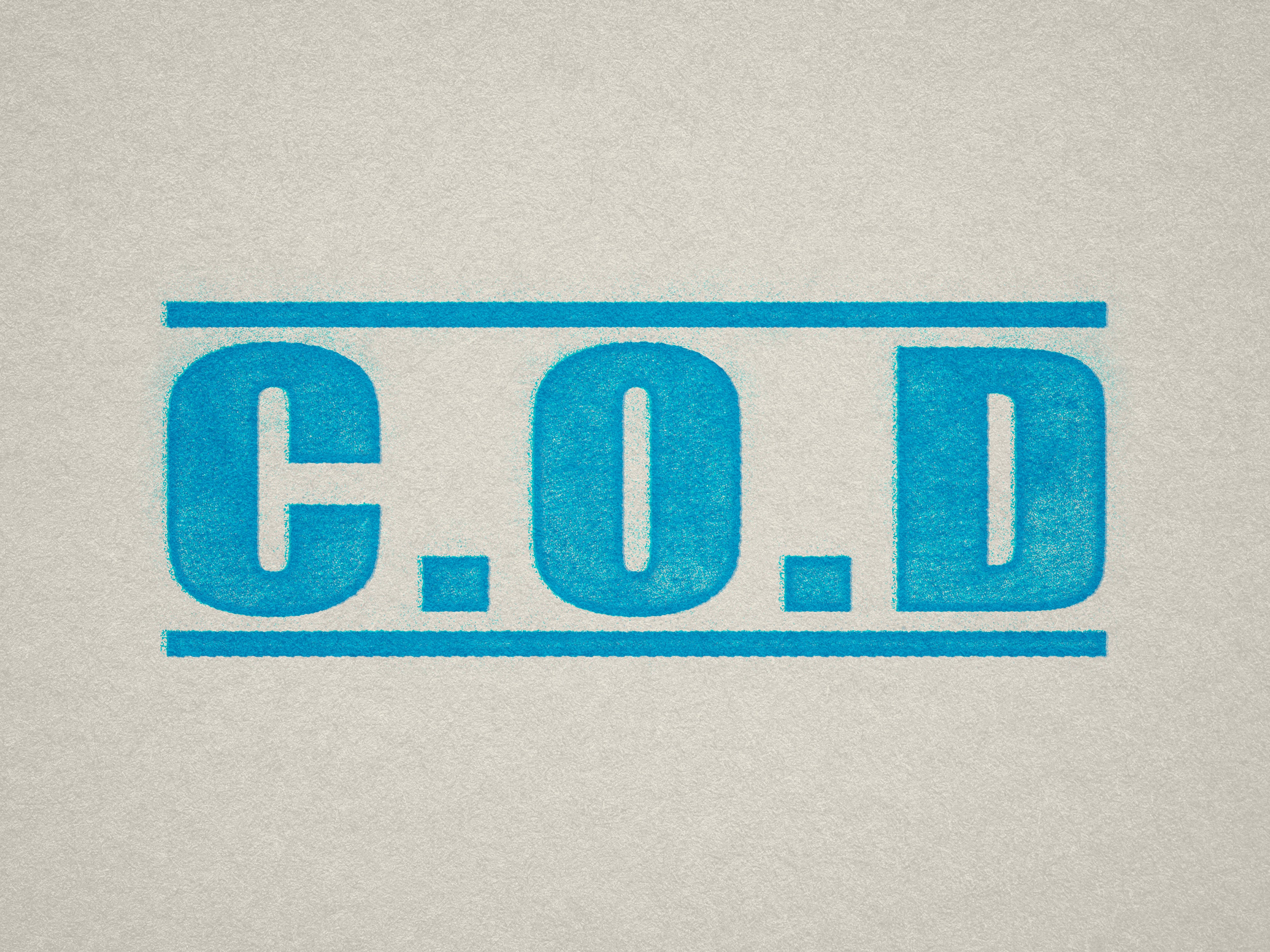 mock up design of COD rubber stamp turquoise ink in paper background stampers hand stamp office business inventory documents C.O.D C O D