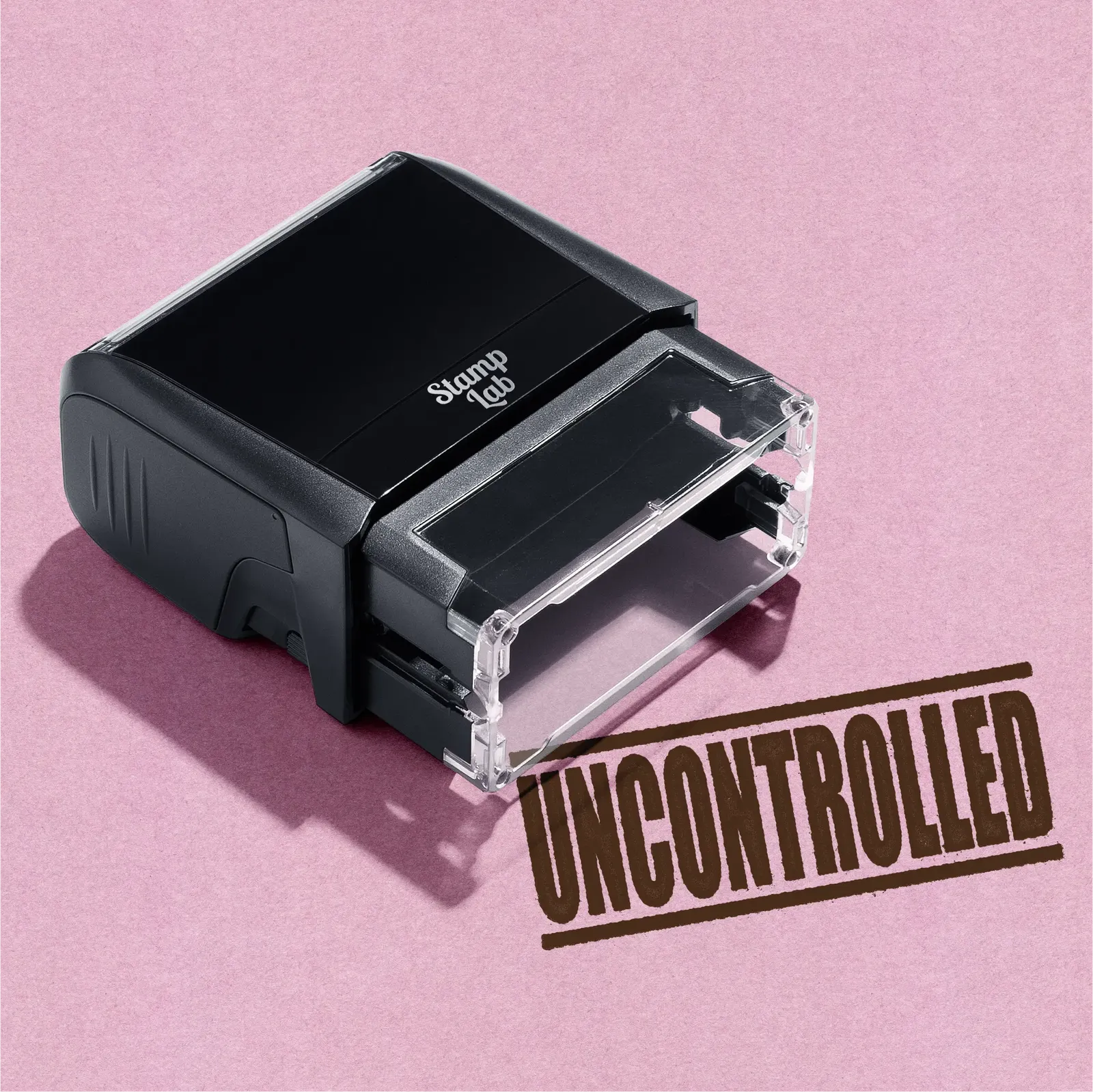 "Mock up design or lifestyle image of 'UNCONTROLLED' rubber stamp brown ink in paper background stampers hand stamp office business inventory documents brown
"