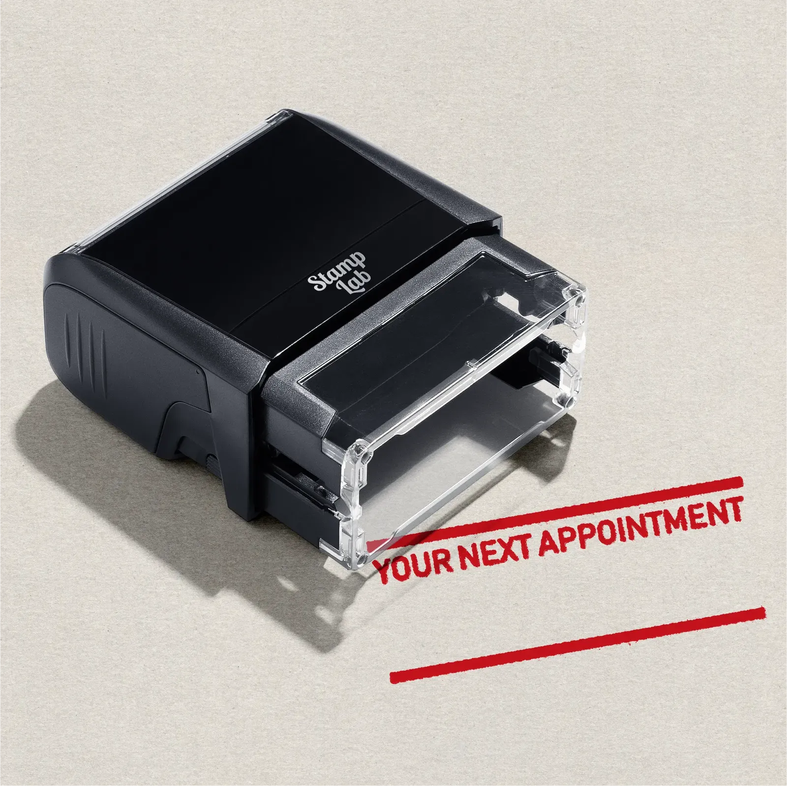 Black stamp with 'Your Next Appointment' text on paper background