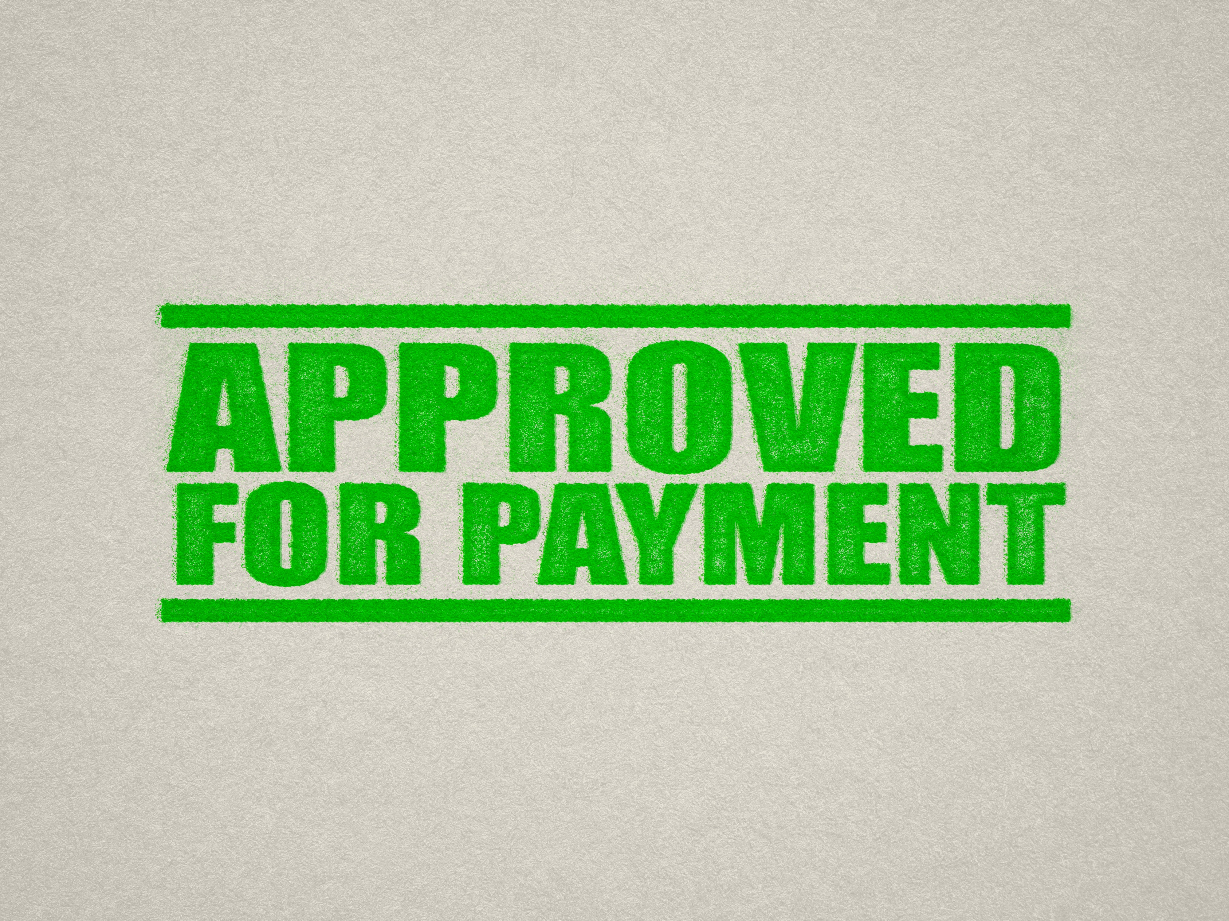 mock up design of 'Approved For Payment" rubber stamp apple green ink in paper background stampers hand stamp office business inventory documents