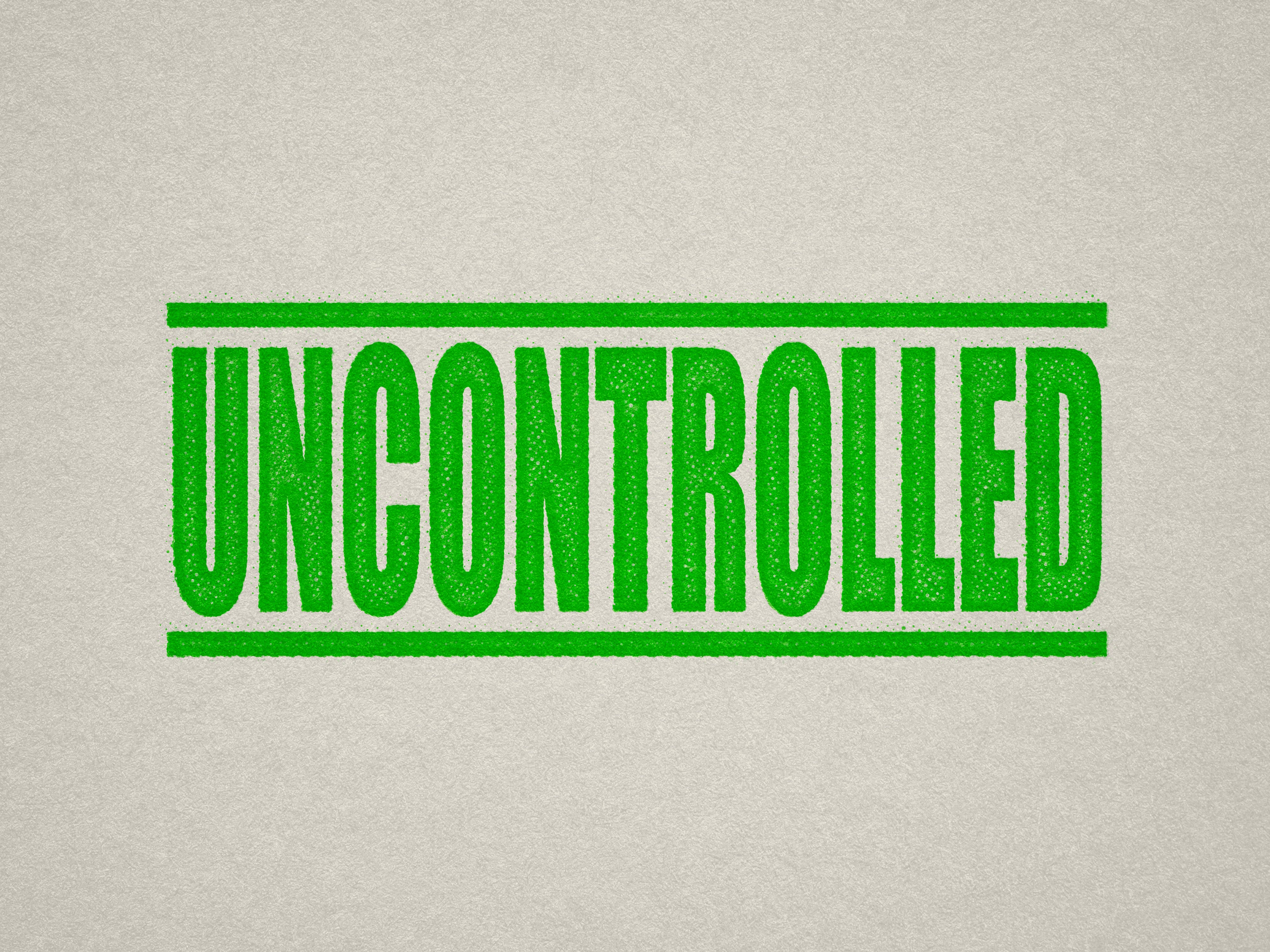 Mock up design or lifestyle image of 'UNCONTROLLED' rubber stamp apple green ink in paper background stampers hand stamp office business inventory documents self inking prefill refillable stamps stamping