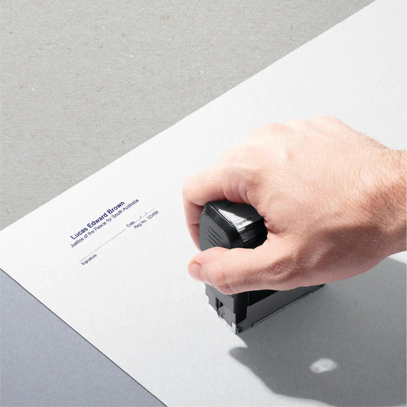 Mand hand stamping Blue SA JP Stamp