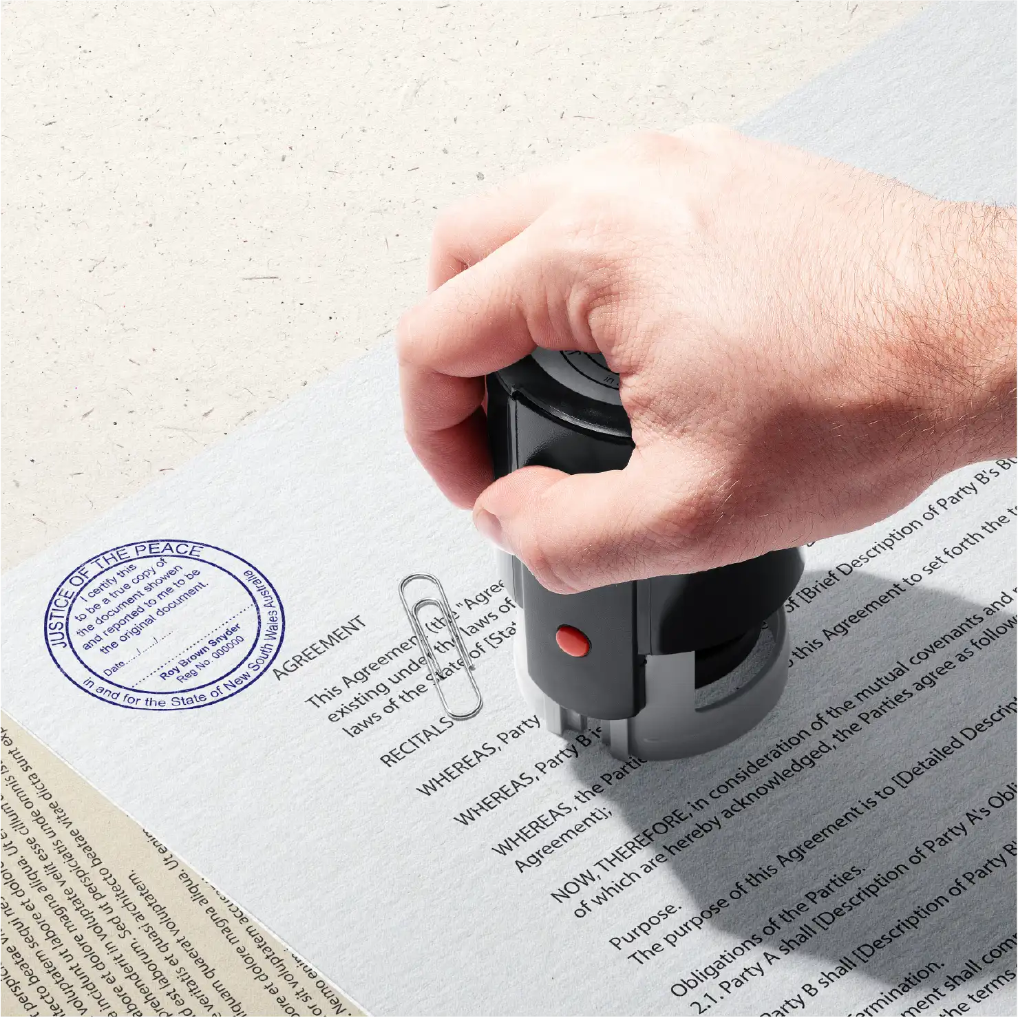 Mockup of Hand stamping Blue Large Round True Copy Stamp on a document
