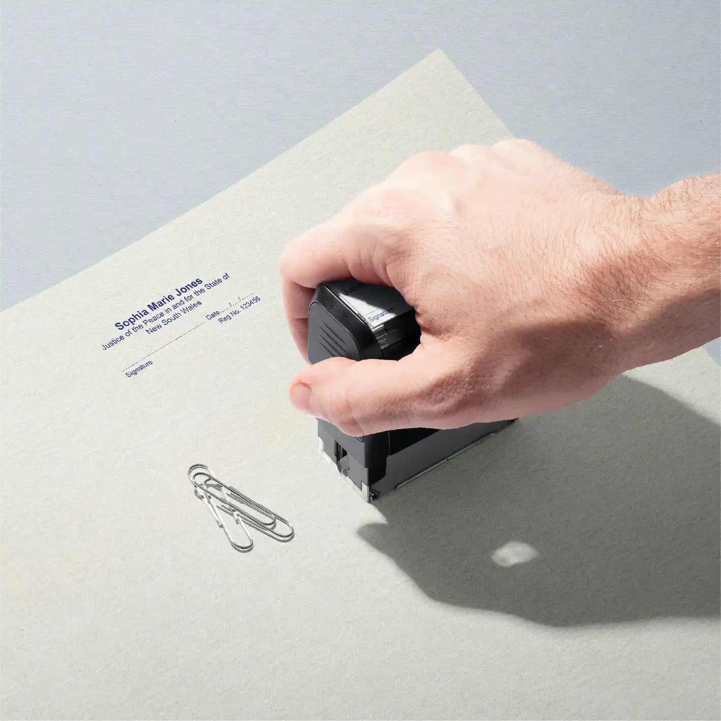 customised NSW JP name stamp Mans hand stamping