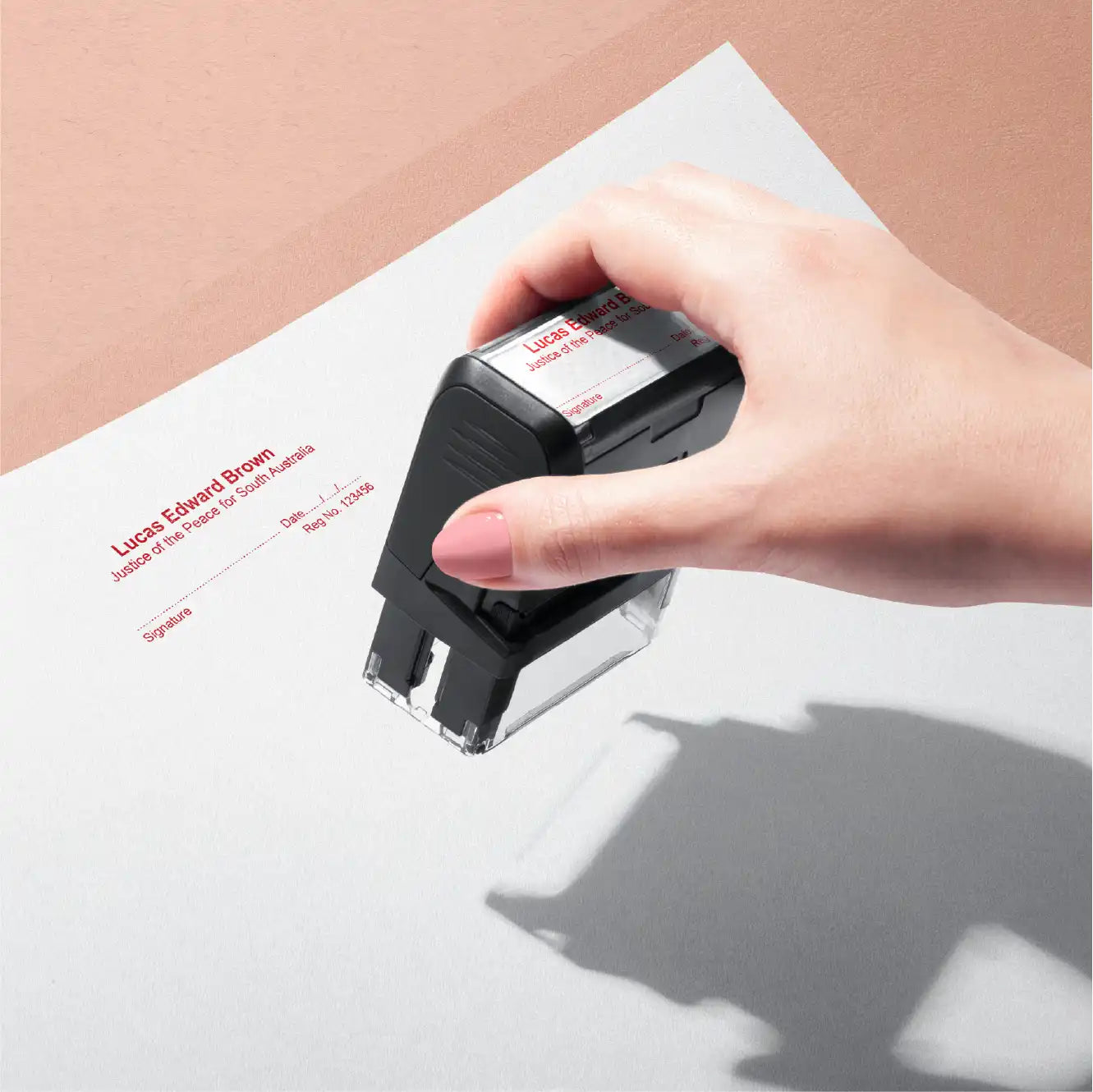 Lady hand stamping personalised JP name stamp red ink or possibly blood