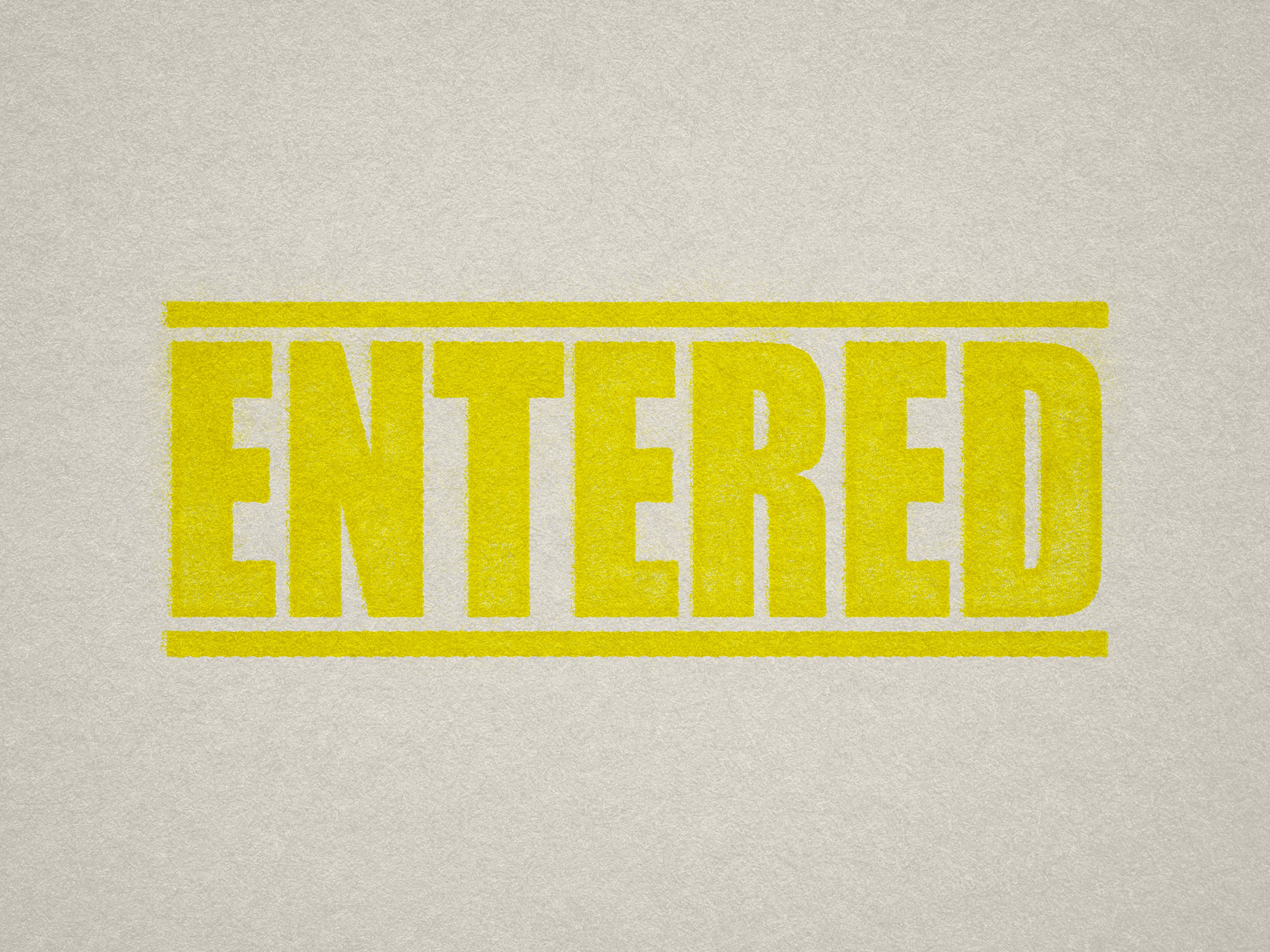 Mock up design or lifestyle image of 'ENTERED' rubber stamp yellow ink in paper background stampers hand stamp office business inventory documents self inking prefill refillable stamps stamping