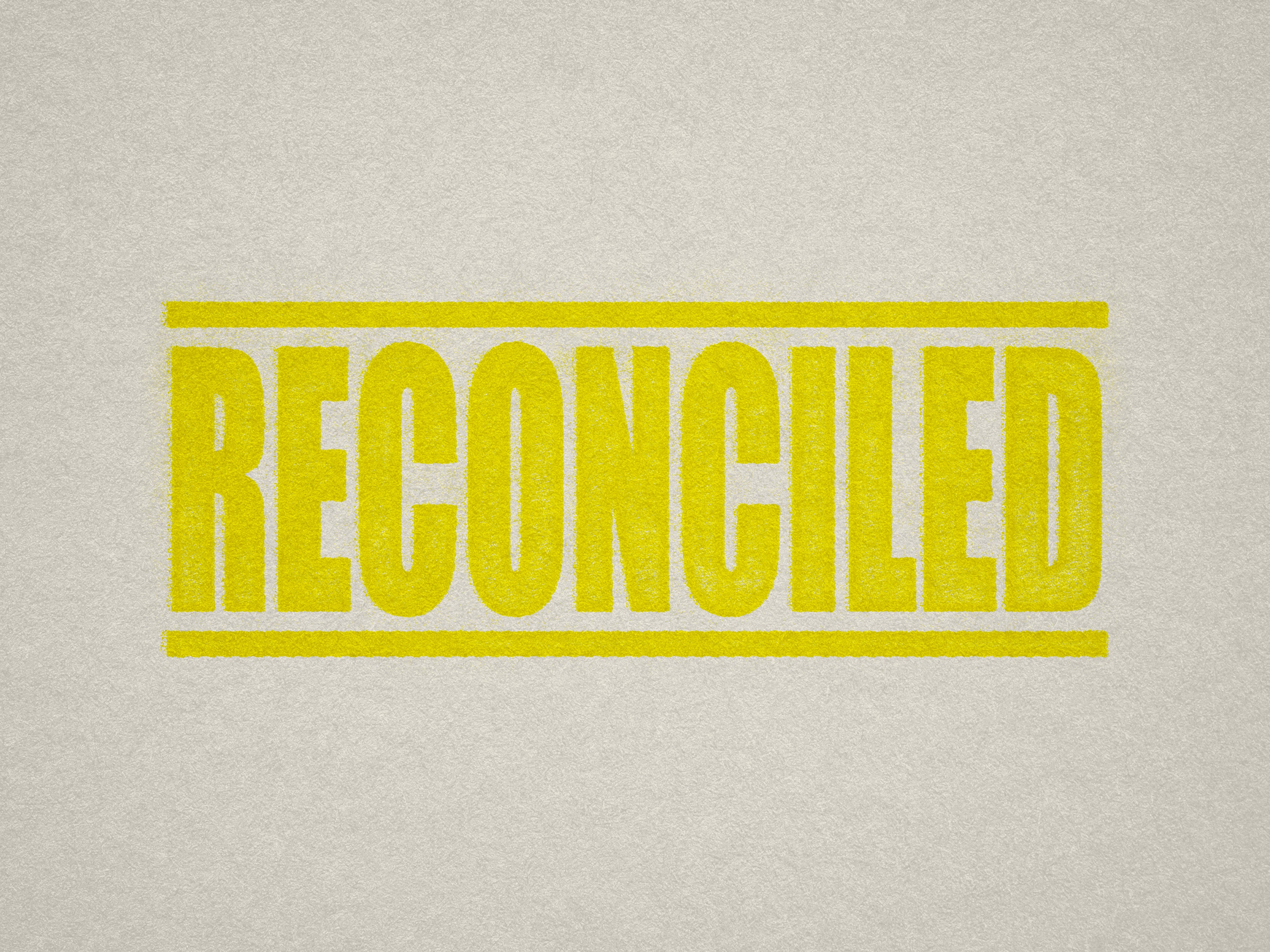 Mock up design or lifestyle image of 'RECONCILED' rubber stamp yellow ink in paper background stampers hand stamp office business inventory documents self inking prefill refillable stamps stamping