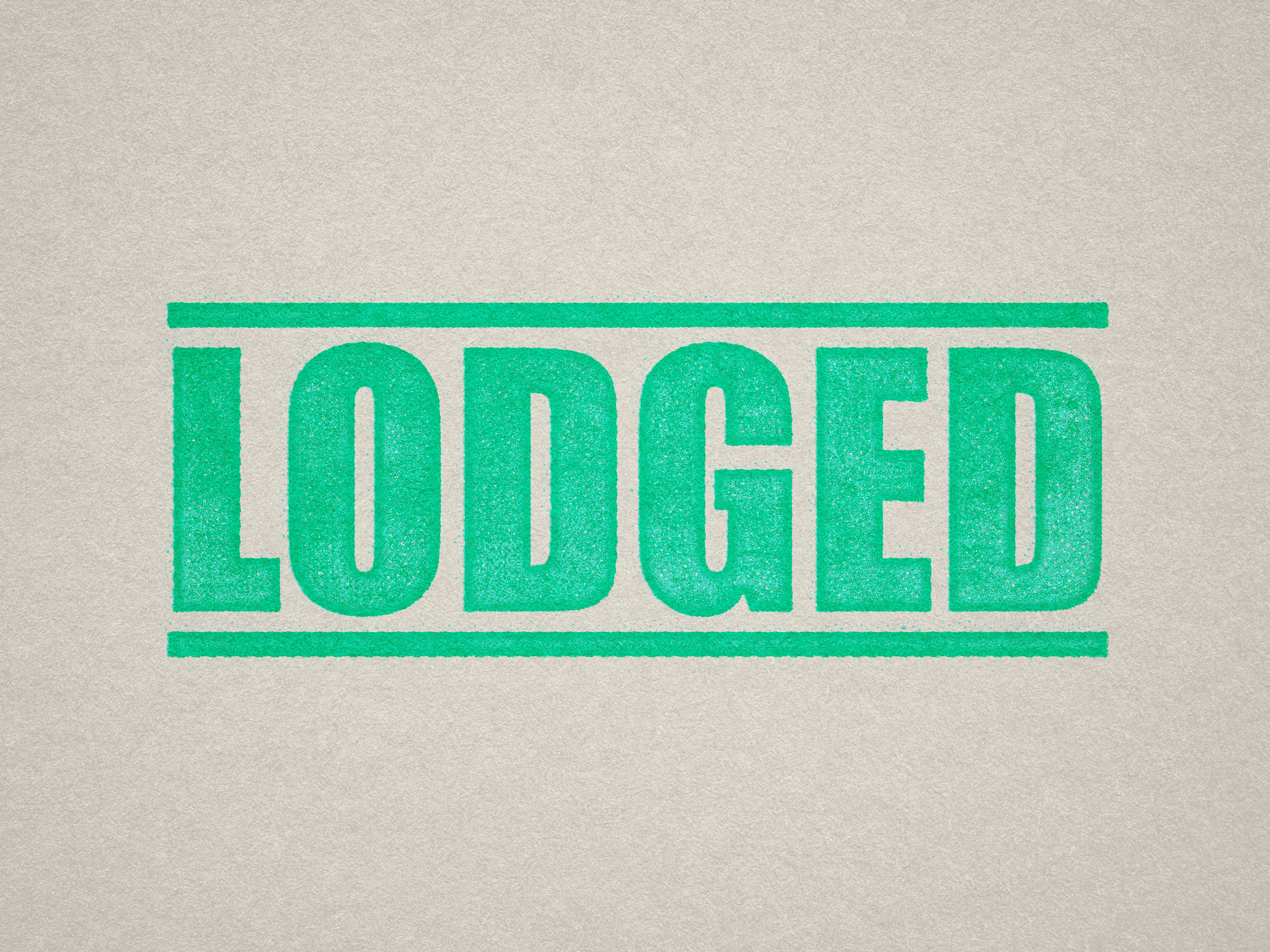 mock up design of 'Lodged' rubber stamp mint ink in paper background stampers hand stamp office business inventory documents