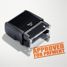 mock up design or lifestyle image of 'Approved For Payment' rubber stamp orange ink in paper background stampers hand stamp office business inventory documents
