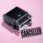 mock up design or lifestyle image of 'Cancelled' rubber stamp black ink in paper background stampers hand stamp office business inventory documents self inking prefill refillable stamps stamping 
